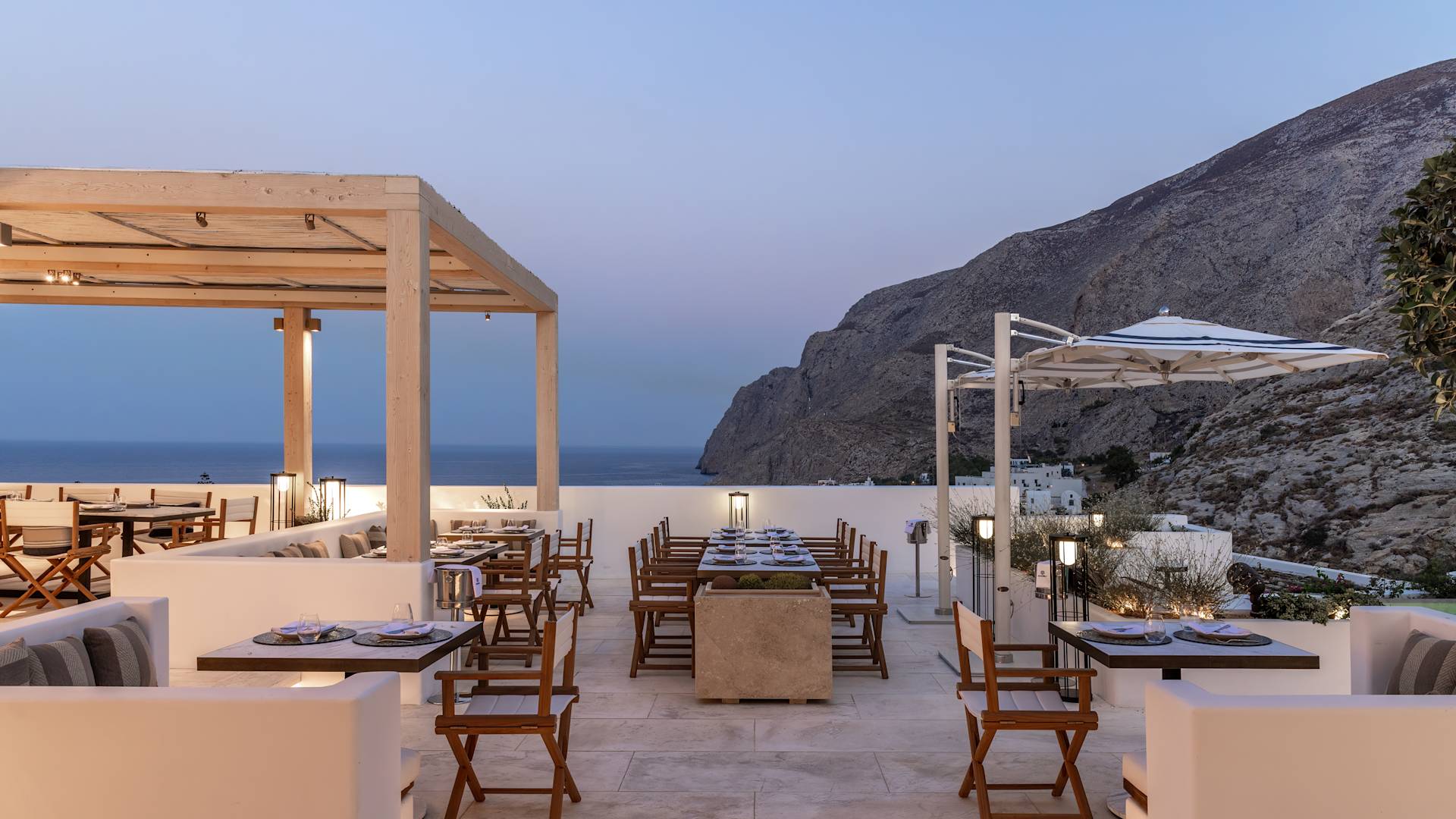 Nectar restaurant outdoor dining area in the evening, overlooking the sea.