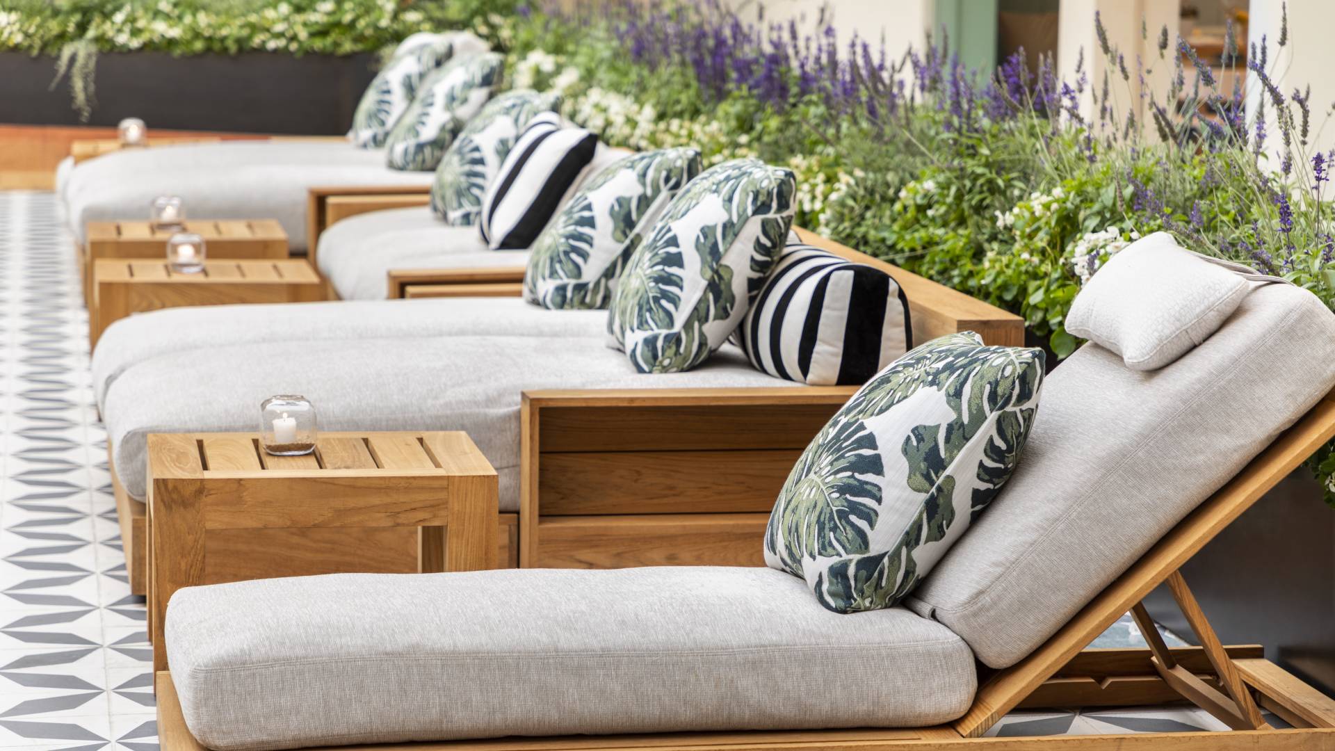 Loungers by the pool with pillows
