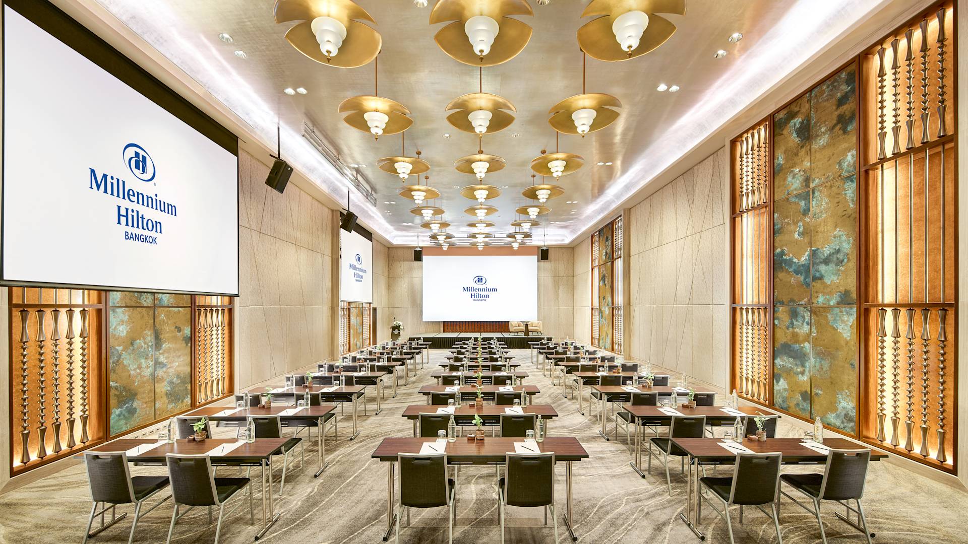 large screens and lots of tables and chairs in Thonburi Ballroom