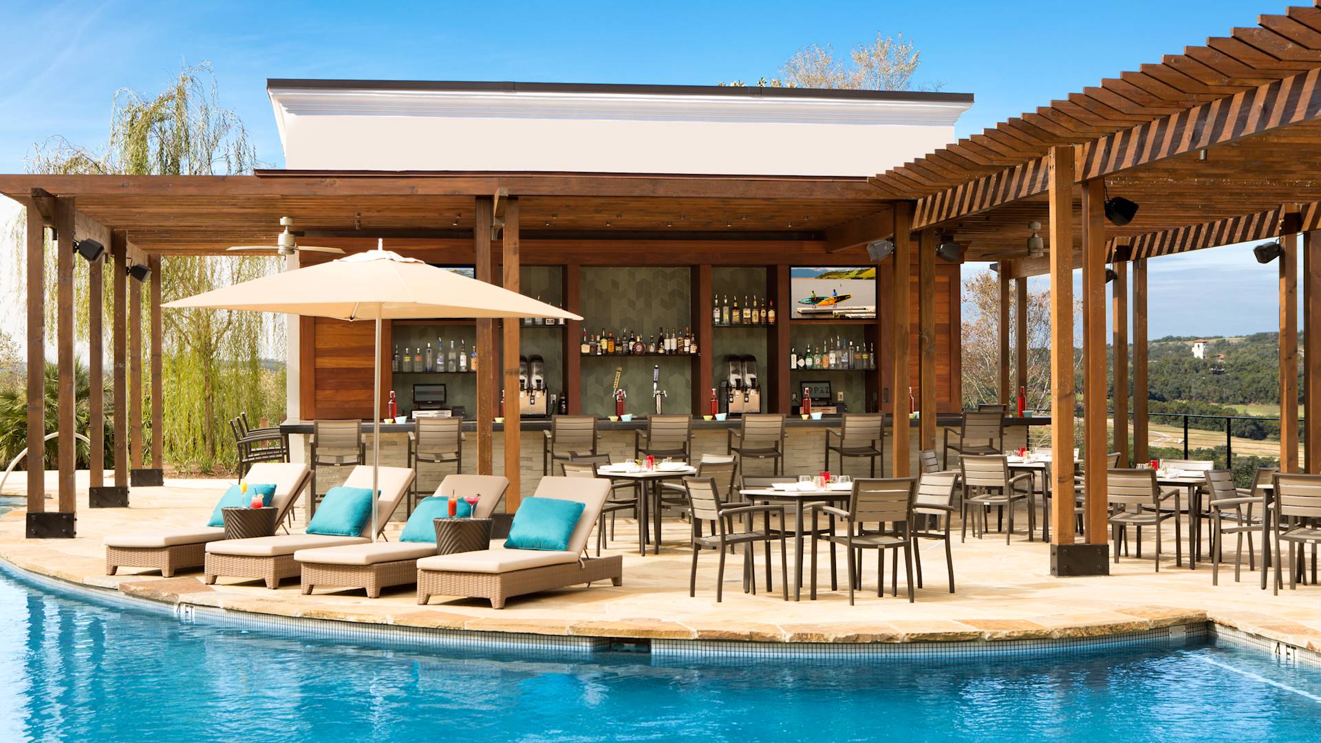 Vista Grille bar areawith outdoor pool and loungers