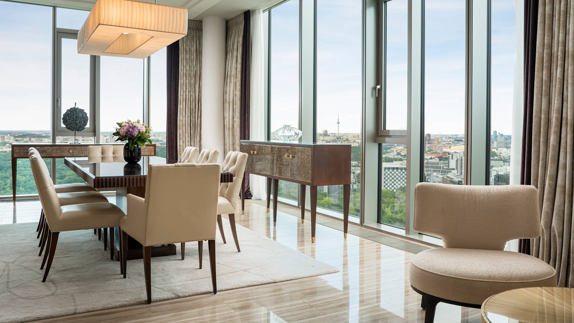 Astor Suite Dining Area with City View from Large Windows