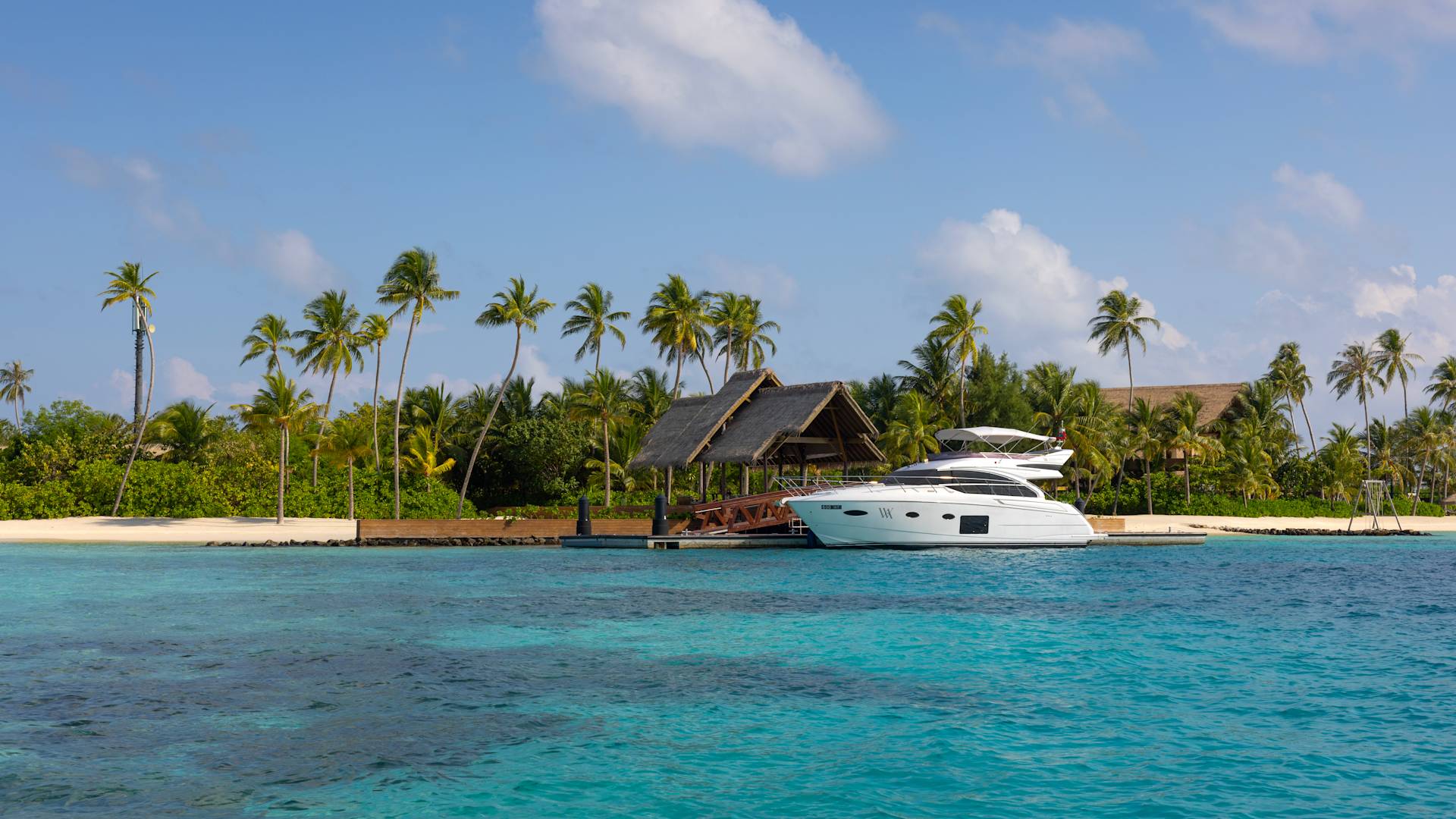 Guest Rooms Building Exterior in an Island with Palm Trees