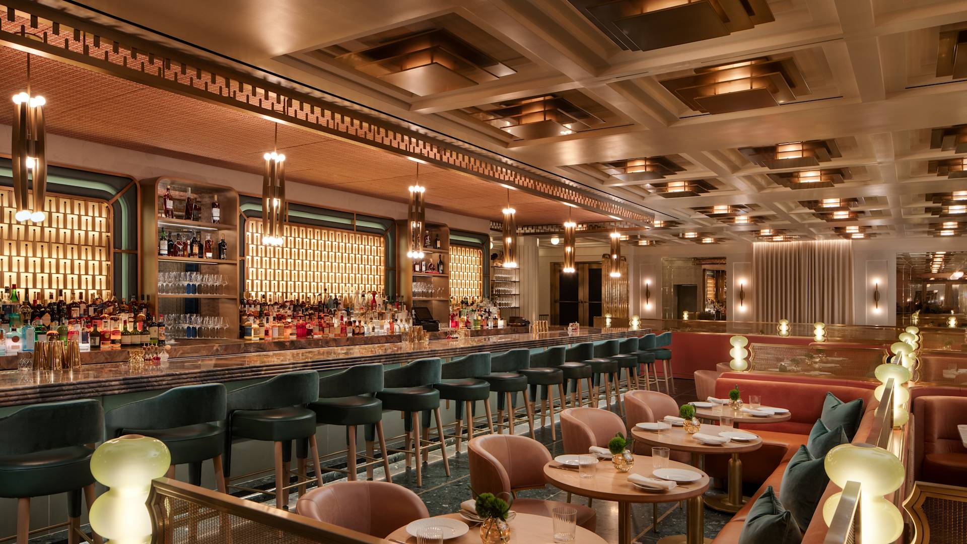Seating area with tables and chairs alongside bar area with stools