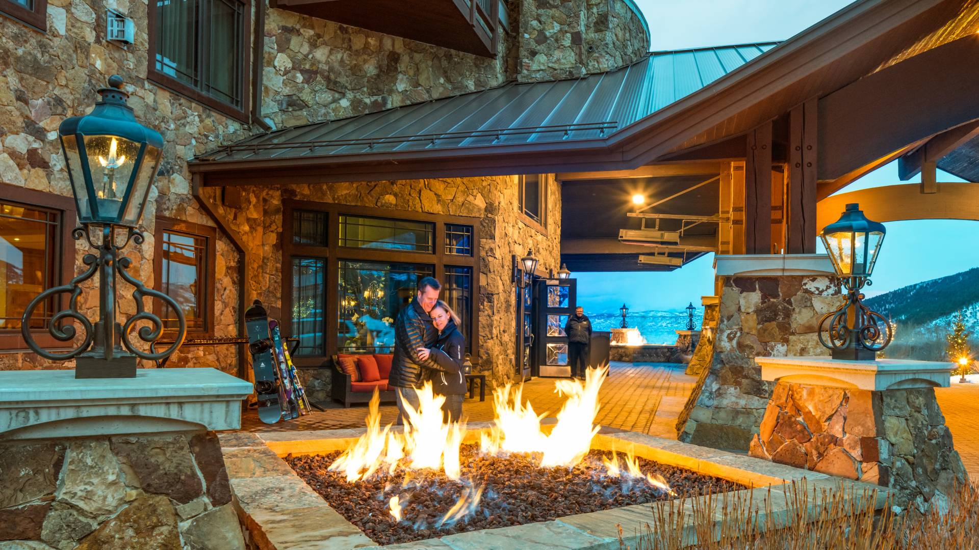 Couple Standing by Outdoor Firepit