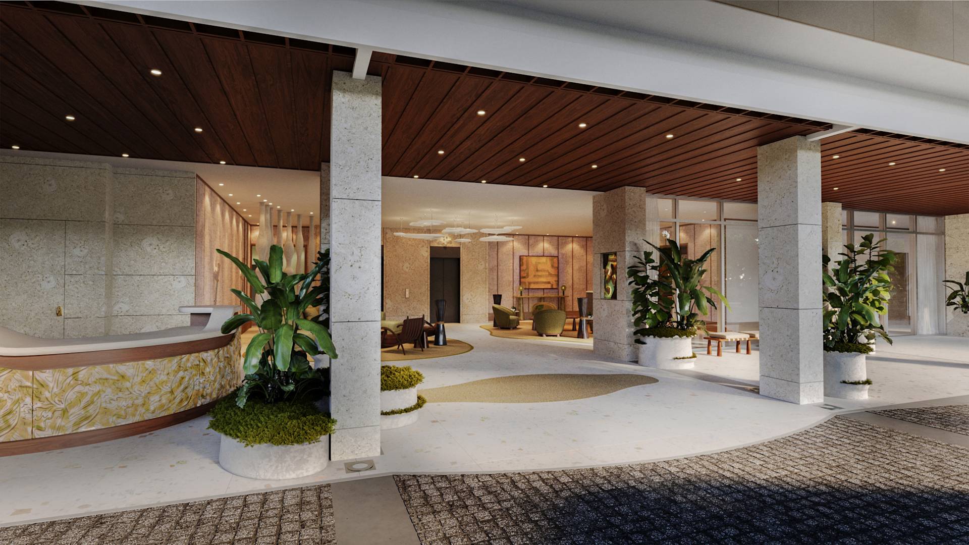 View of Lobby Area with Large Plants next to White Columns