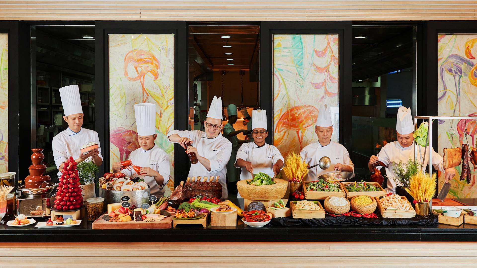 a Team of Chefs Preparing Food at Oscars Restaurant