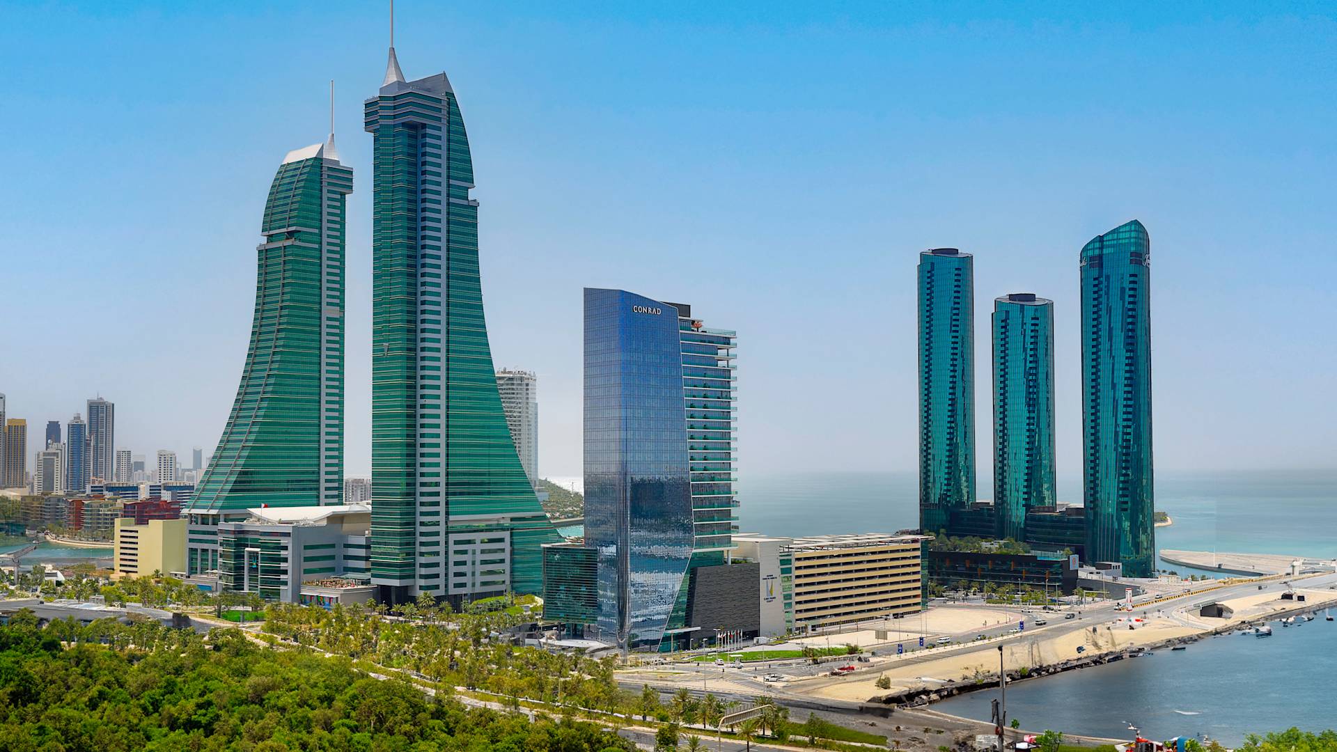 Conrad Bahrain Financial Harbour hotel exterior and surrounding buildings with view of the harbour