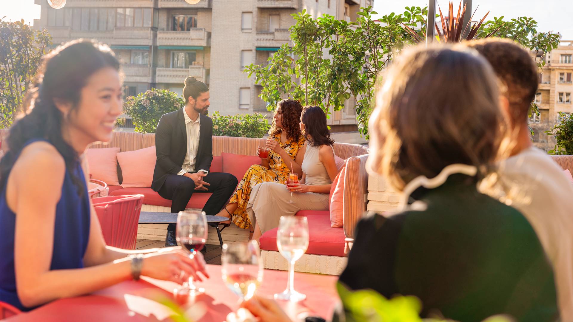 Group of people in outdoor seating area with drinks-transition