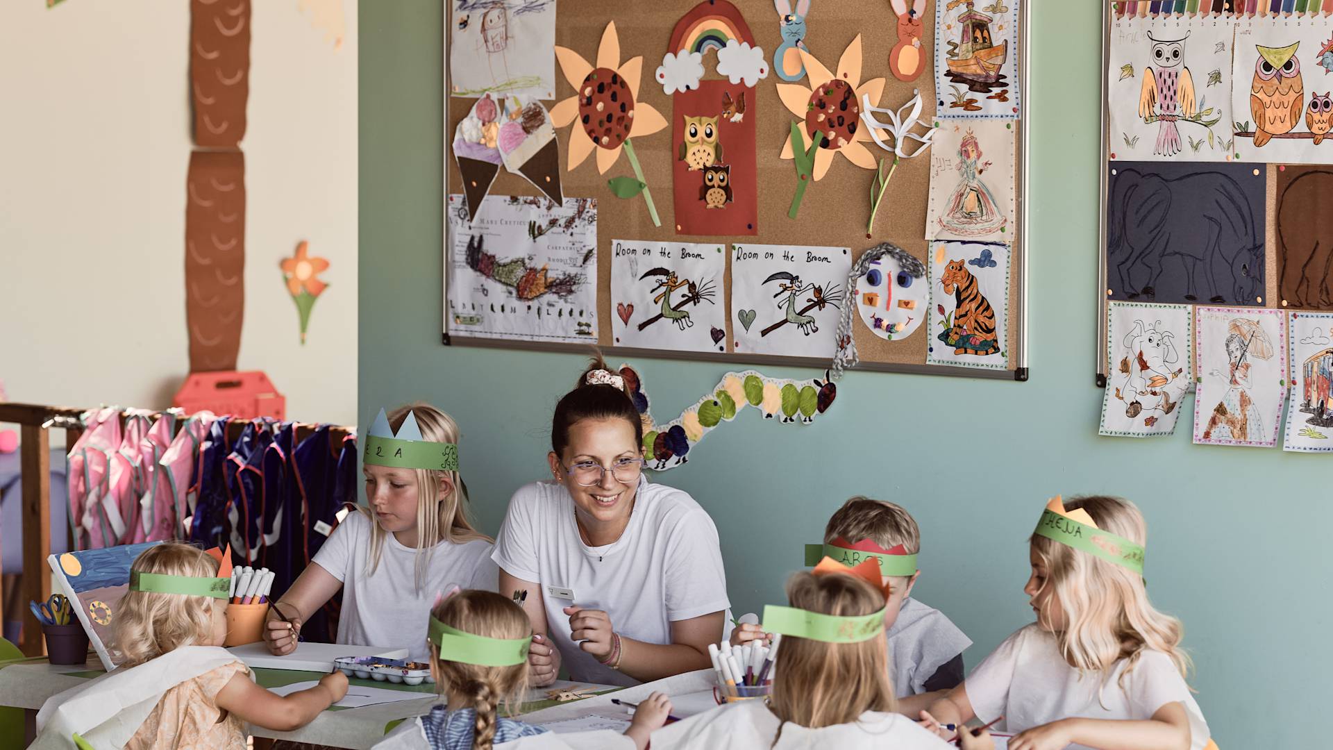 Woman and  with Six Girls during a Coloring Activity-transition