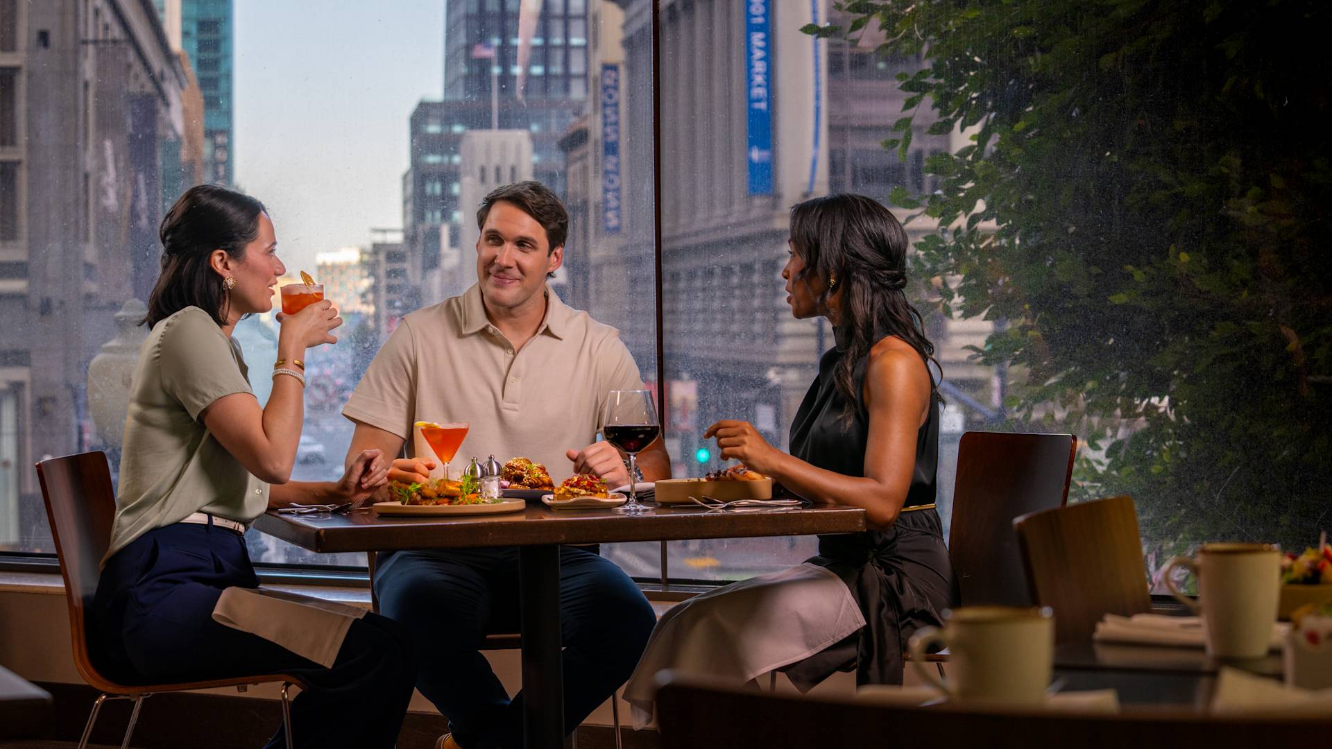 People dining at Cable 55 restaurant with city view-transition