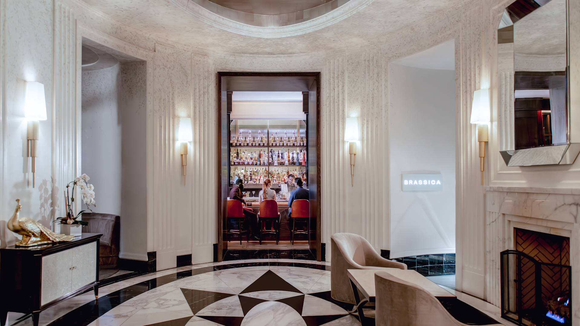 Lobby area with seating and fire place-transition