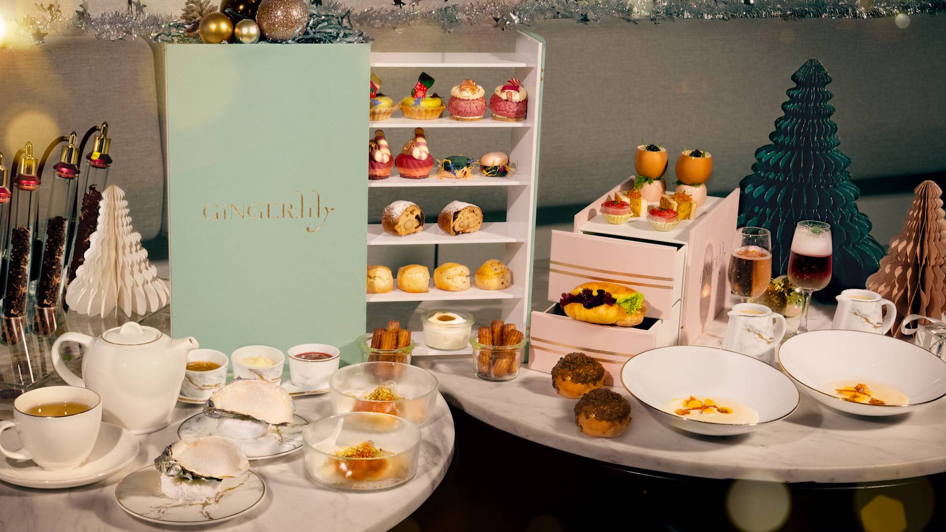 Ginger.Lily Festive Afternoon Tea tea setting with pastries and holiday decorations-transition