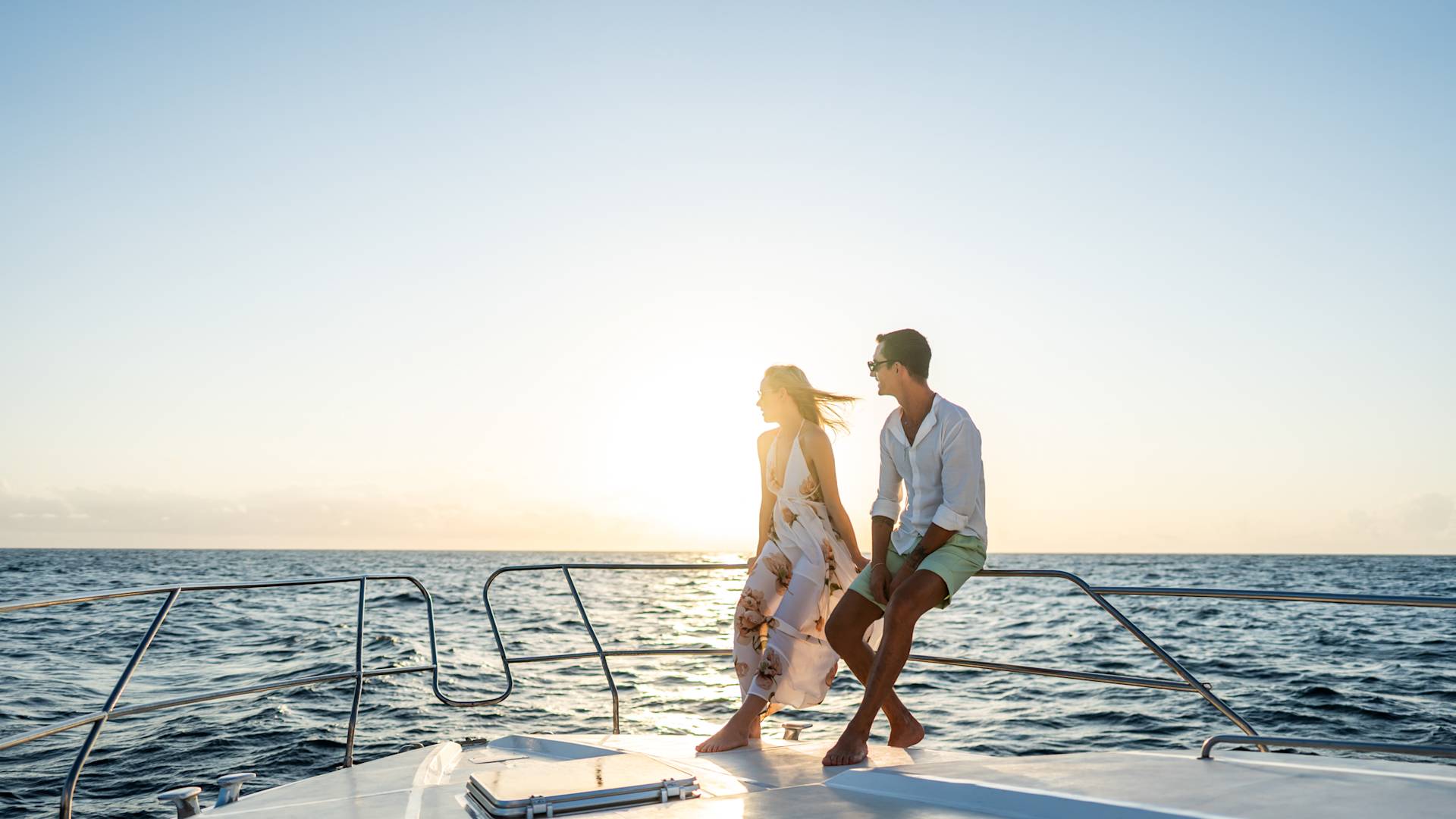 Couple Riding a Boat on the Water at Sunset-transition