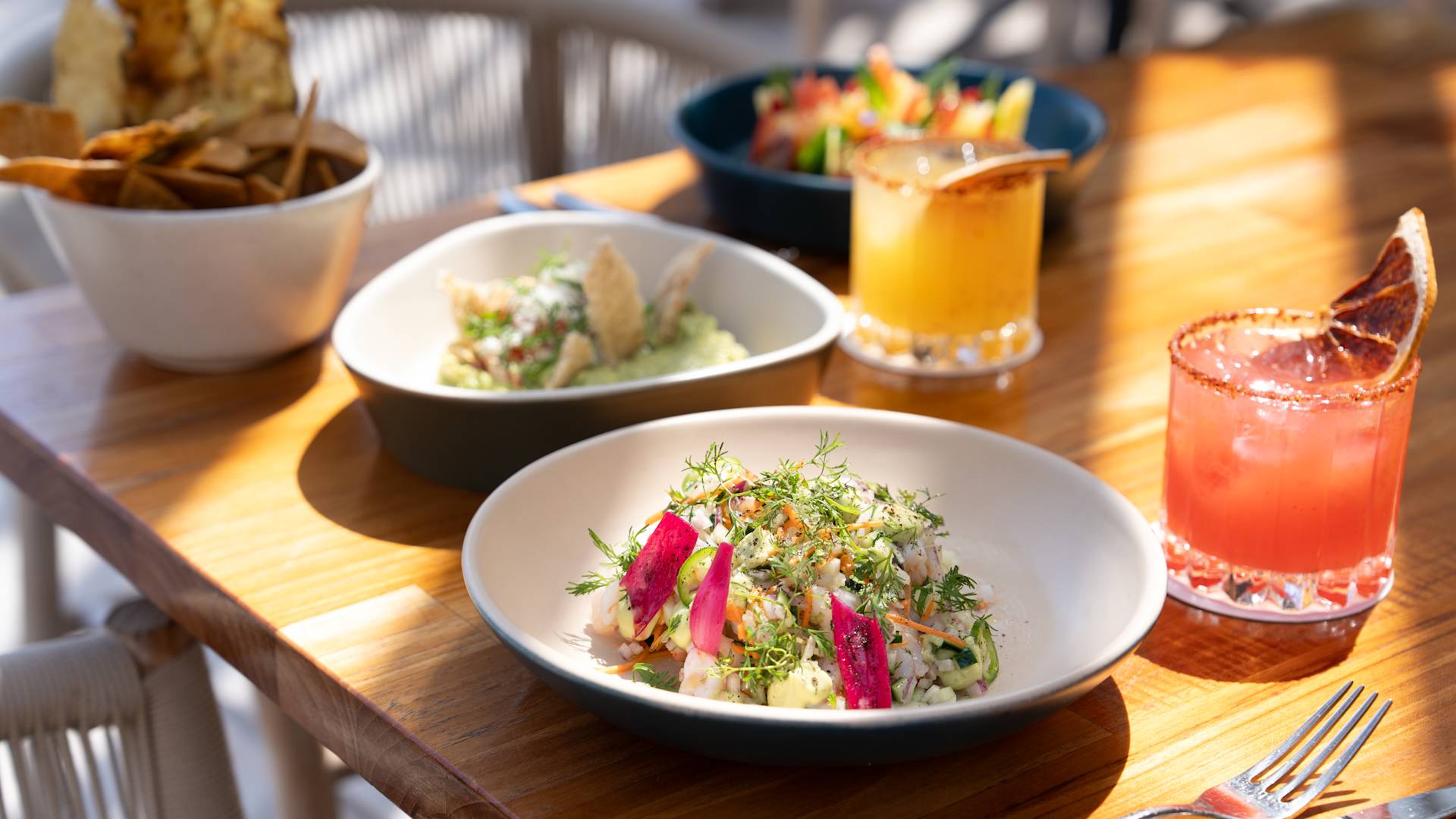 Salads and Drinks on a Table at the Pool Bar-next-transition