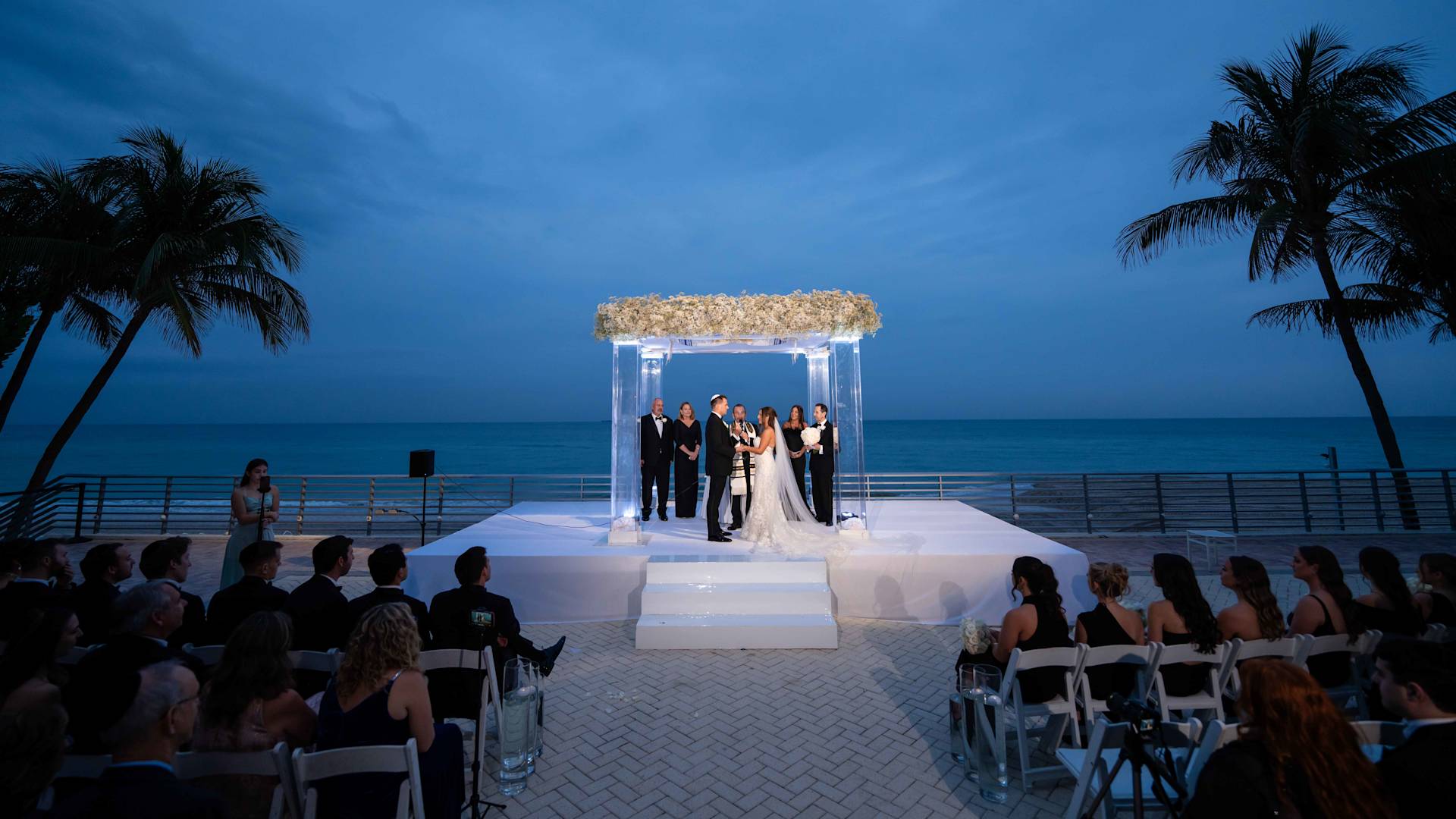 a Wedding Celebration at the Beach at Night-transition