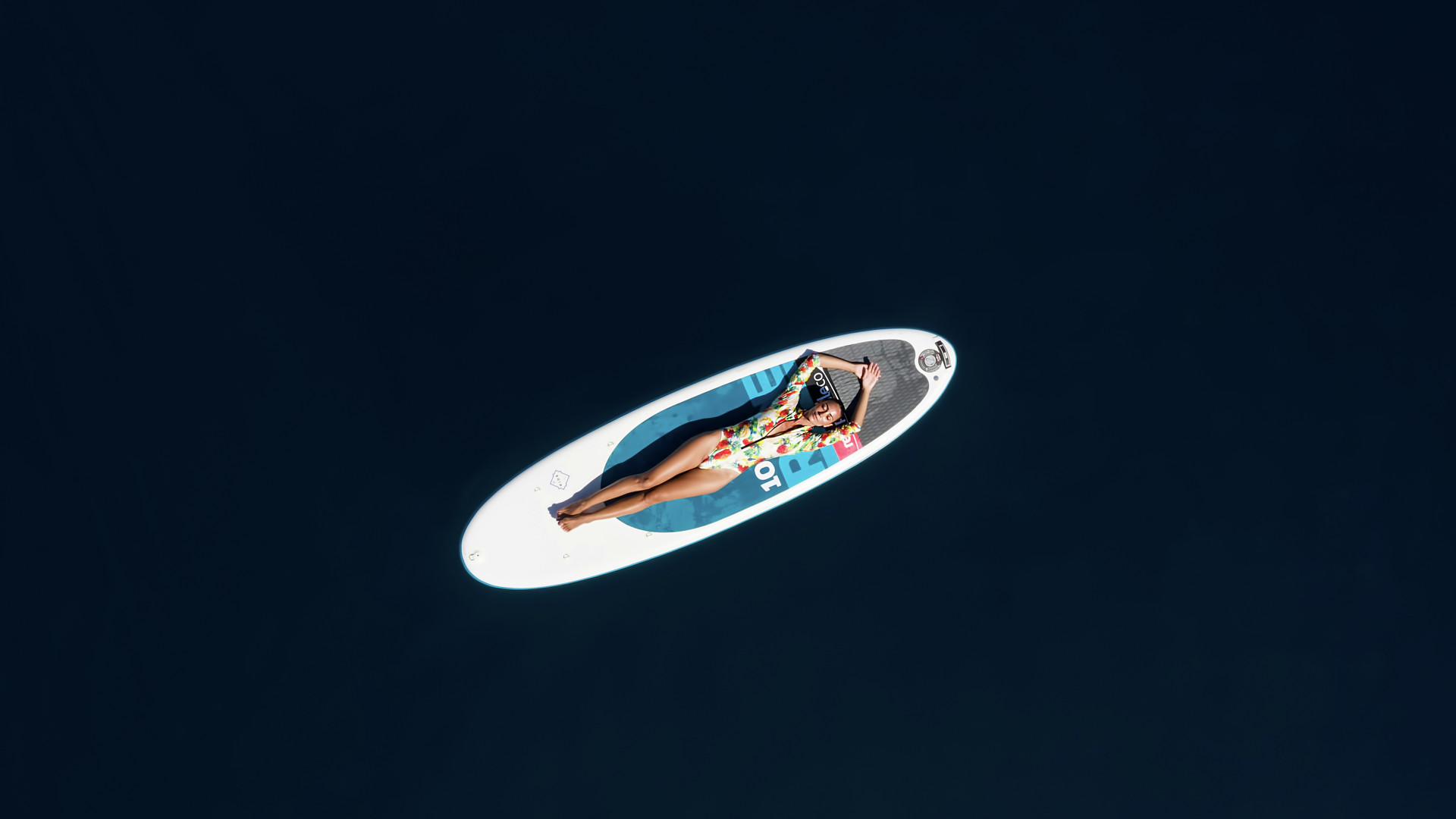 Women relaxing on a Paddleboard
