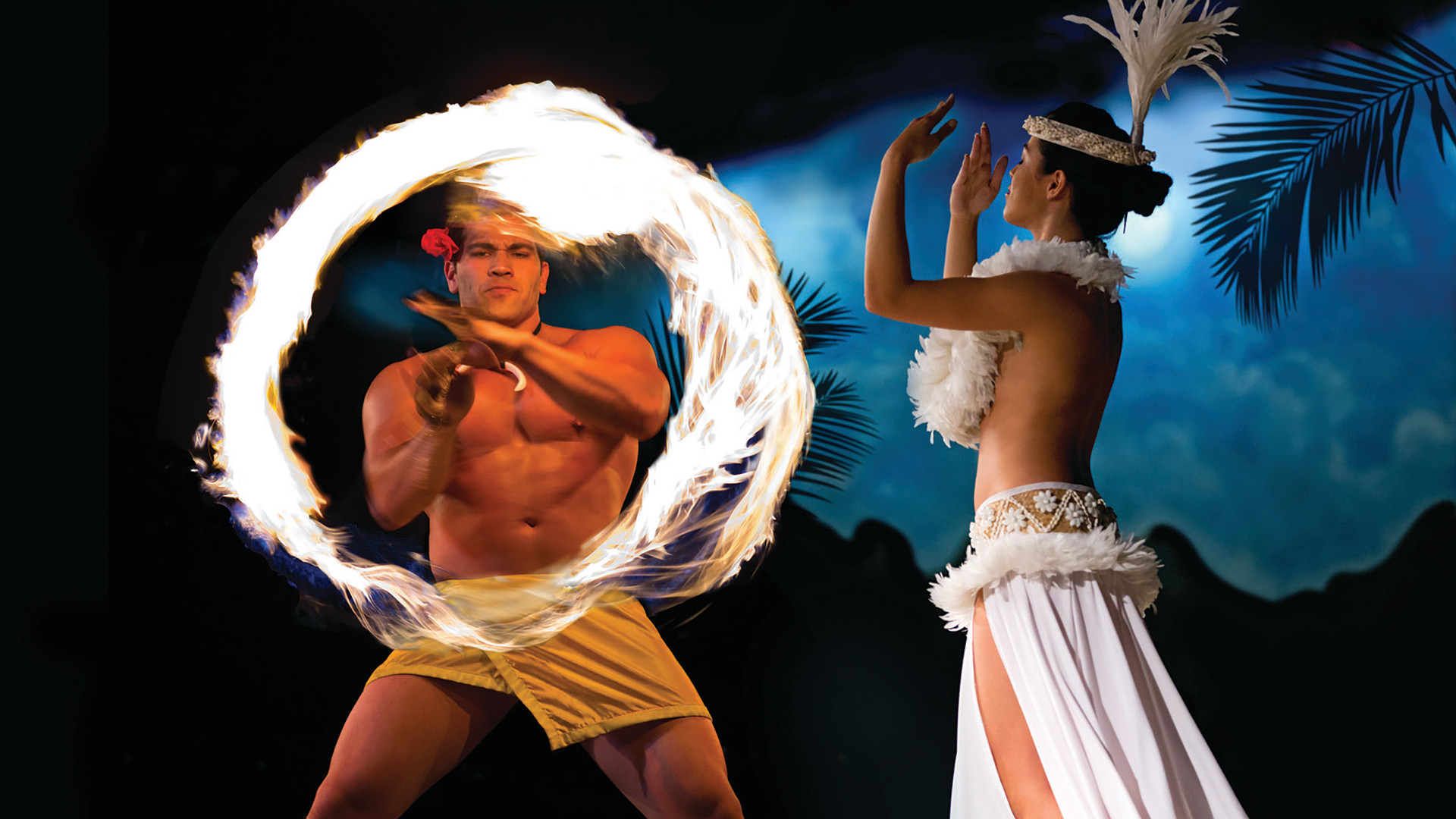 Fire Knife Dancer at a Waikiki Starlight Luau-transition-image