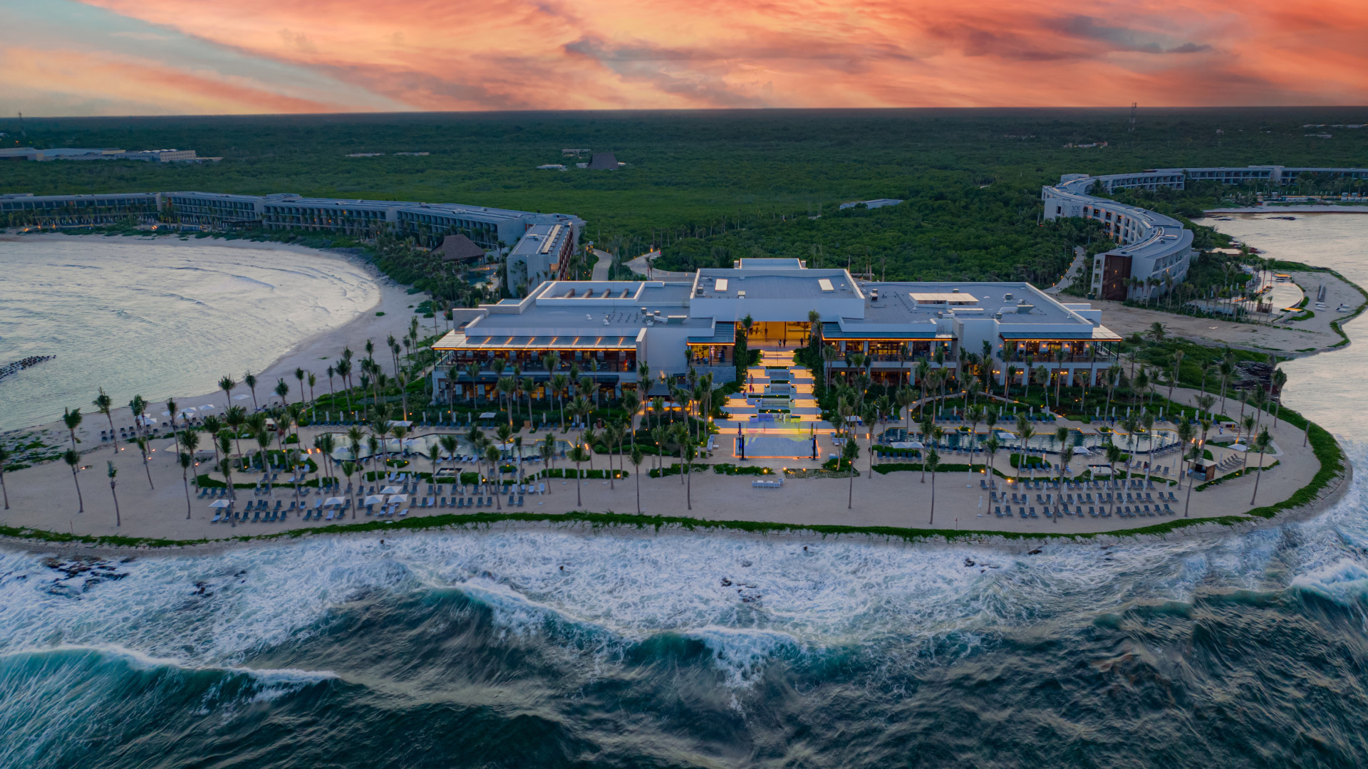 Aerial View of Hilton Tulum Hotel Exterior by the Ocean at Sunset-transition-image