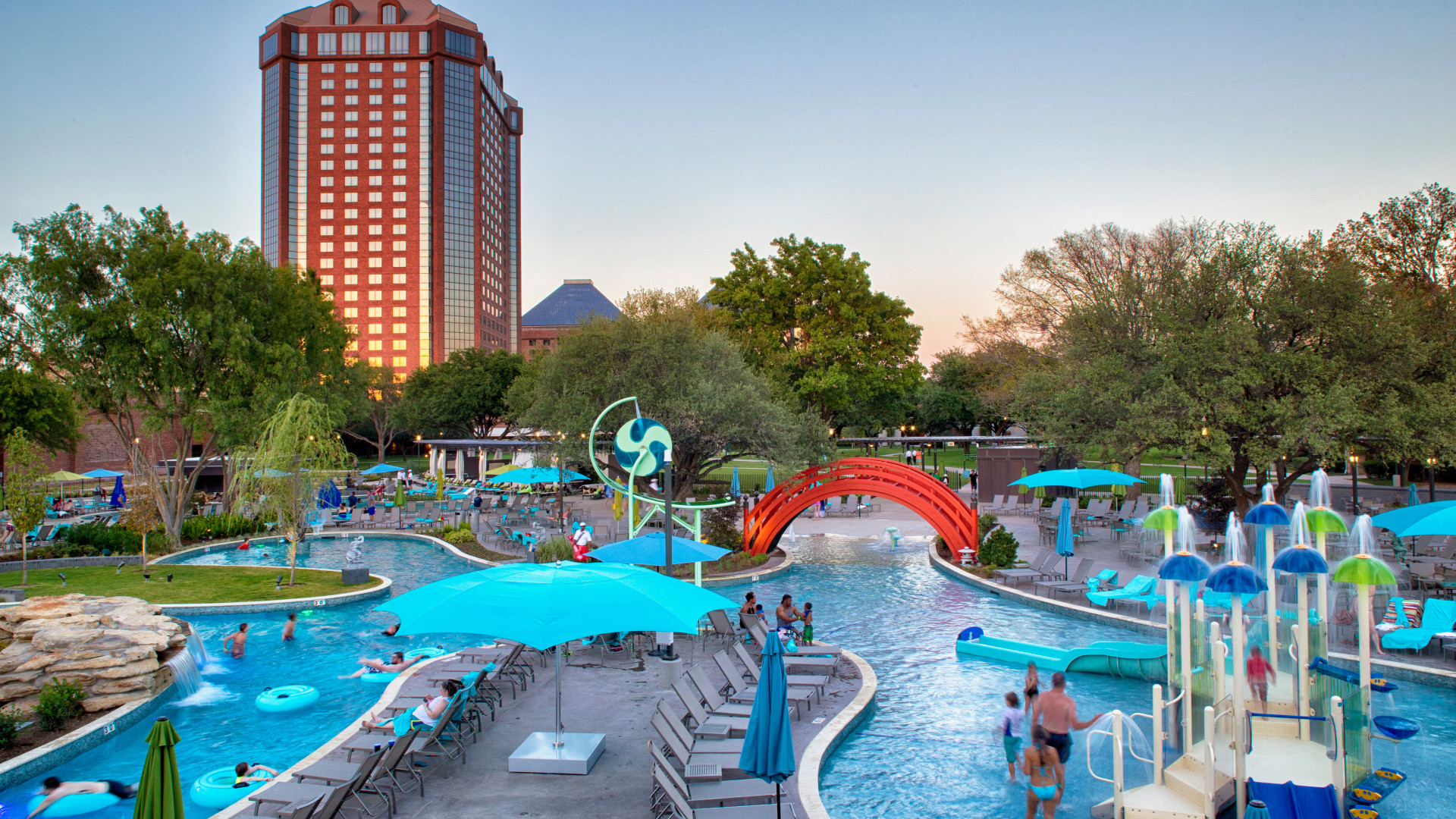 jade waters outdoor water park with guests at dusk-transition-image