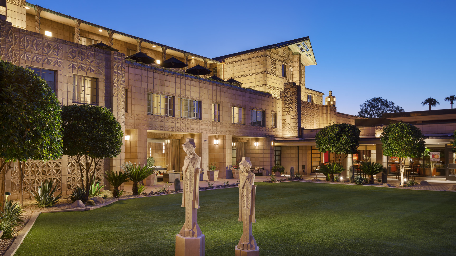 View of hotel exterior with statues-transition-image