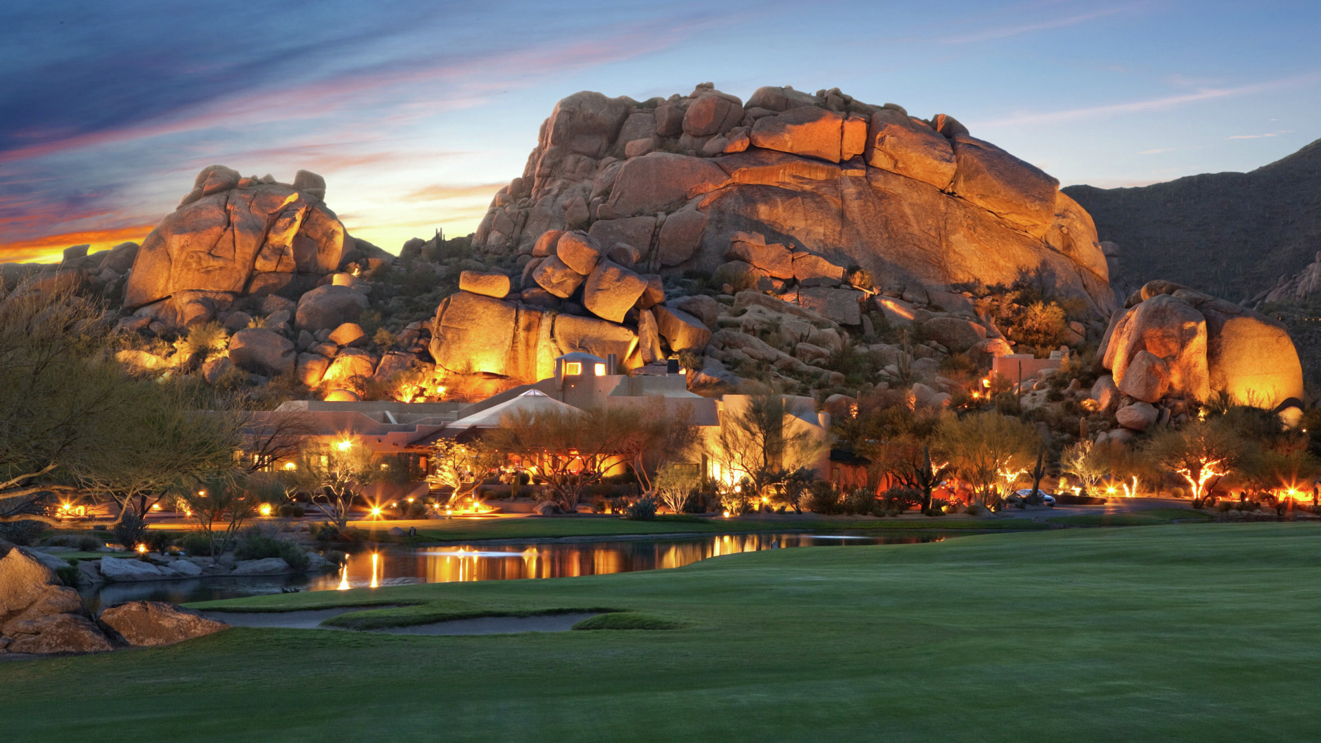 Boulders Resort & Spa lit up at dusk-transition