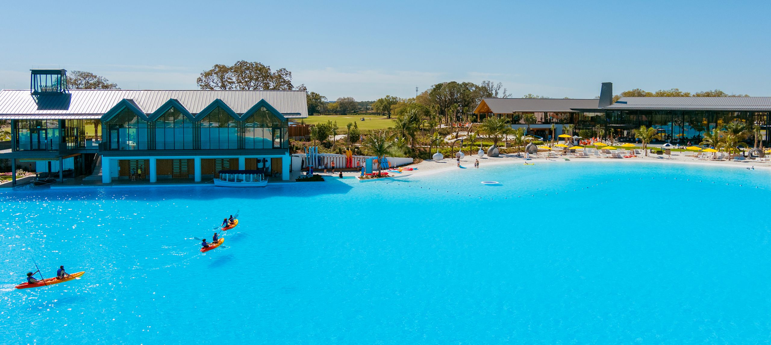 People on Rowing Boats on the Water at Conrad Orlando Hotel 
