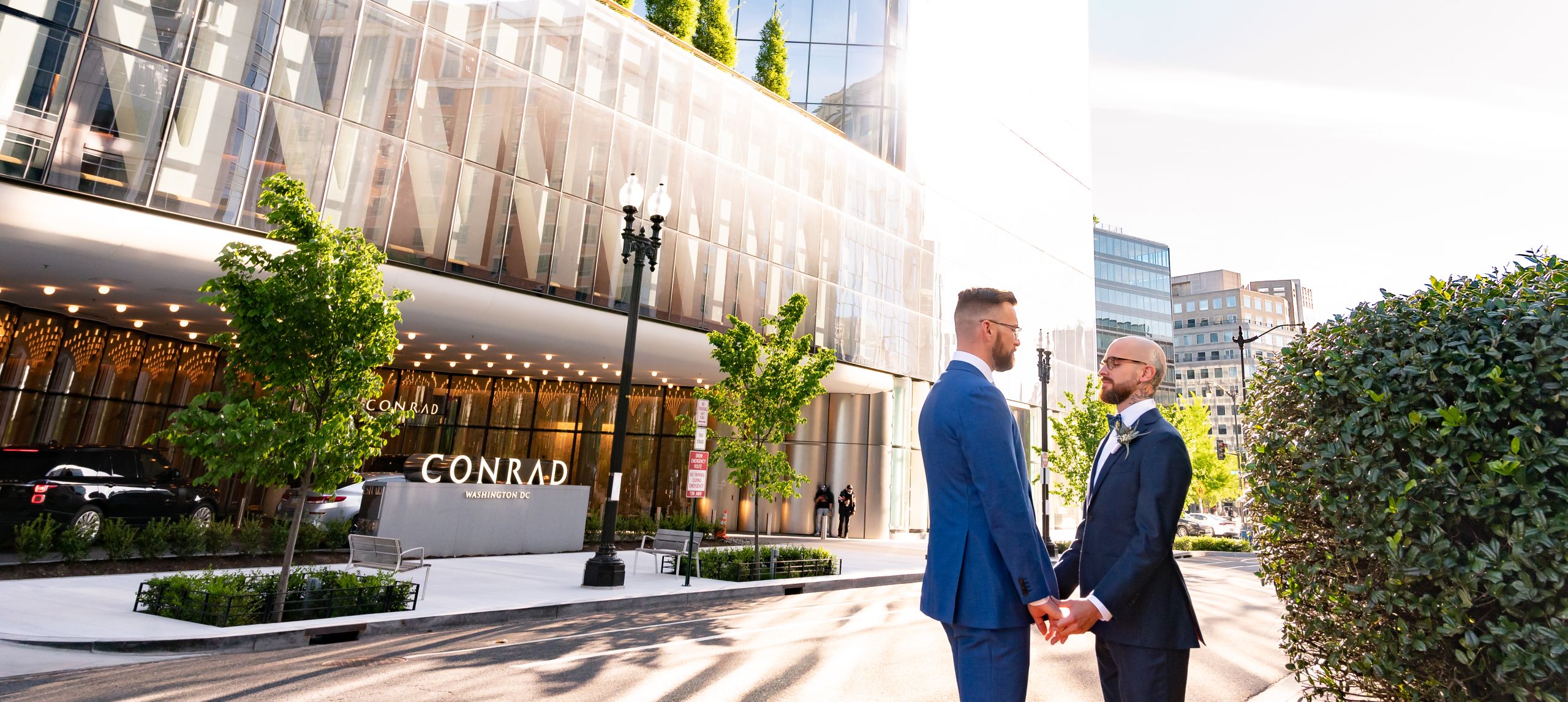 Couple standing outside hotel at daytime