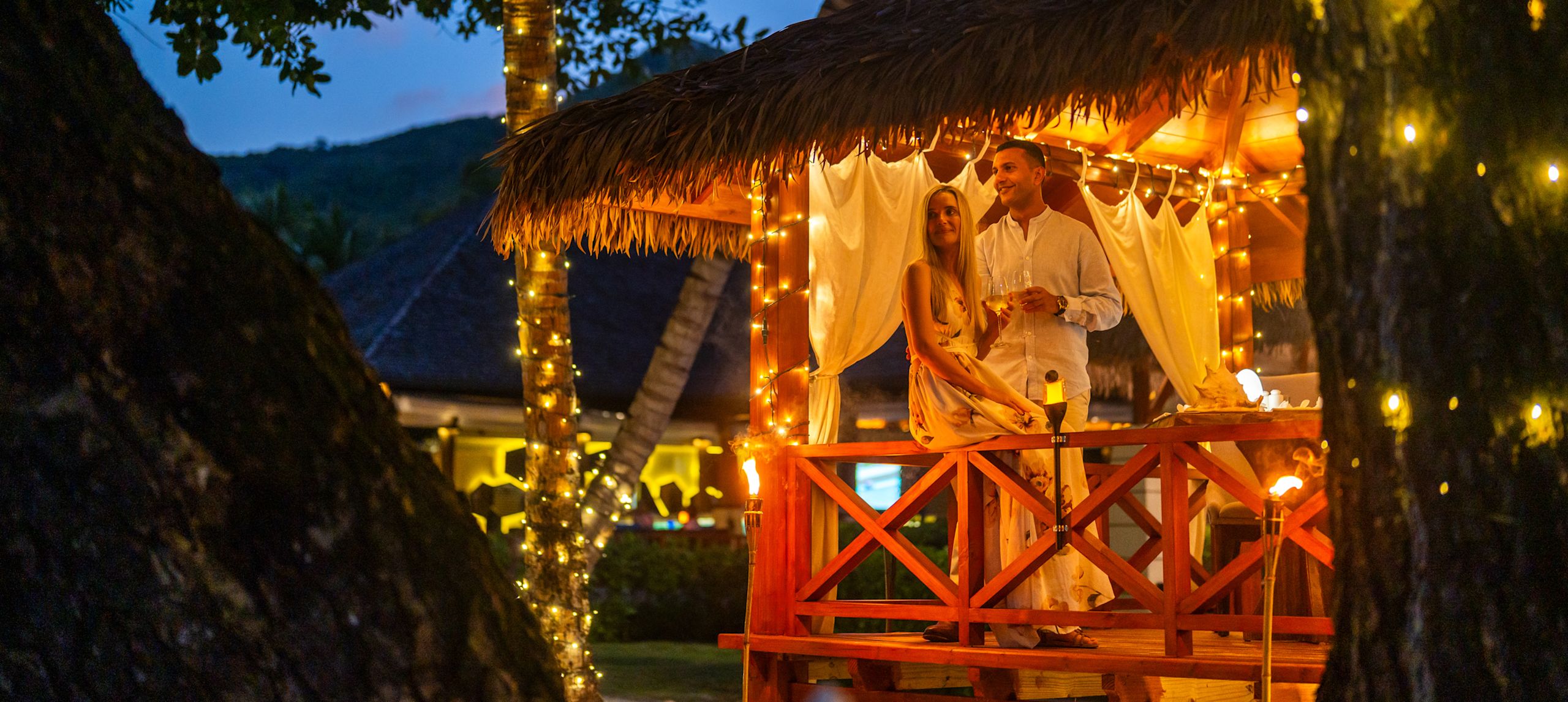 Couple Enjoying a Romantic Candlelight Dinner Outdoors