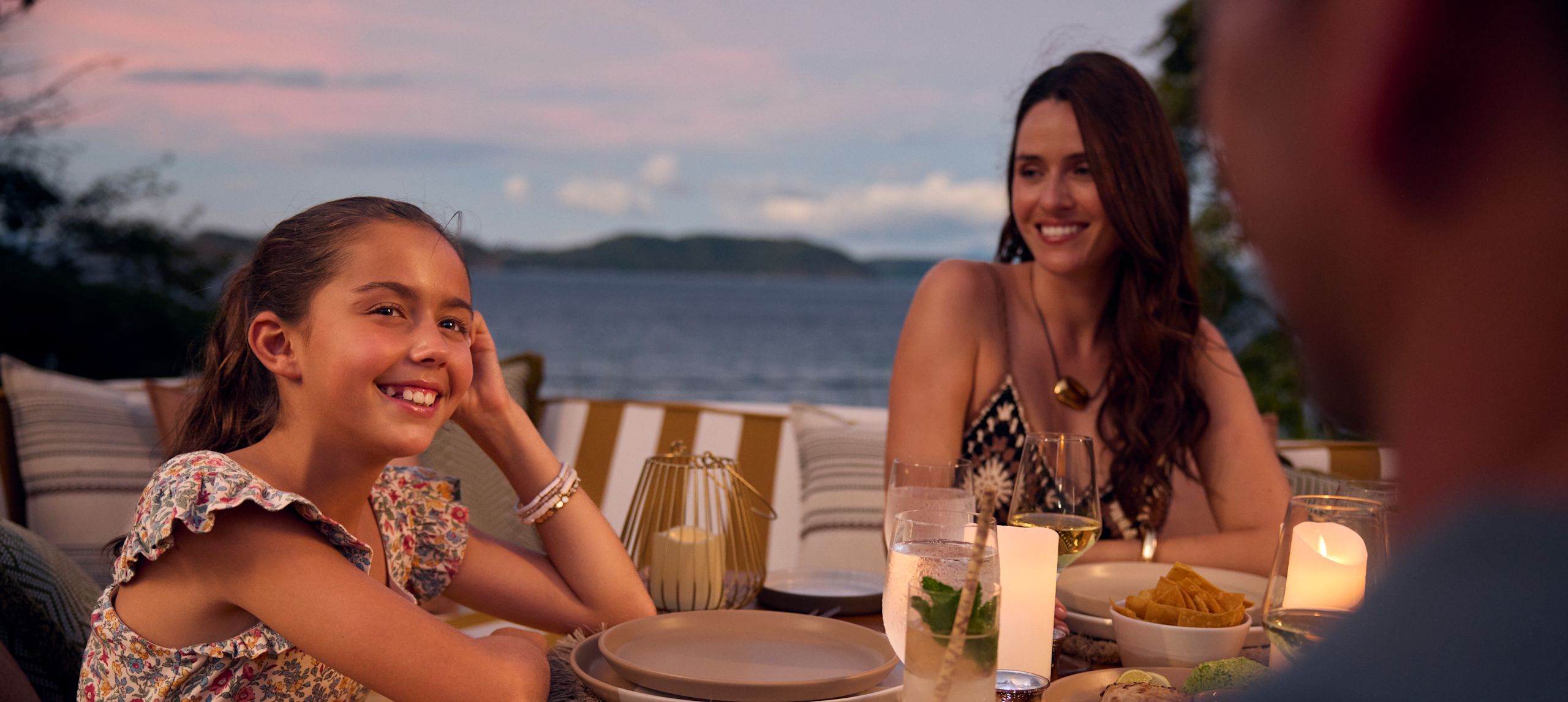 Family Dining on a Terrace with Ocean View