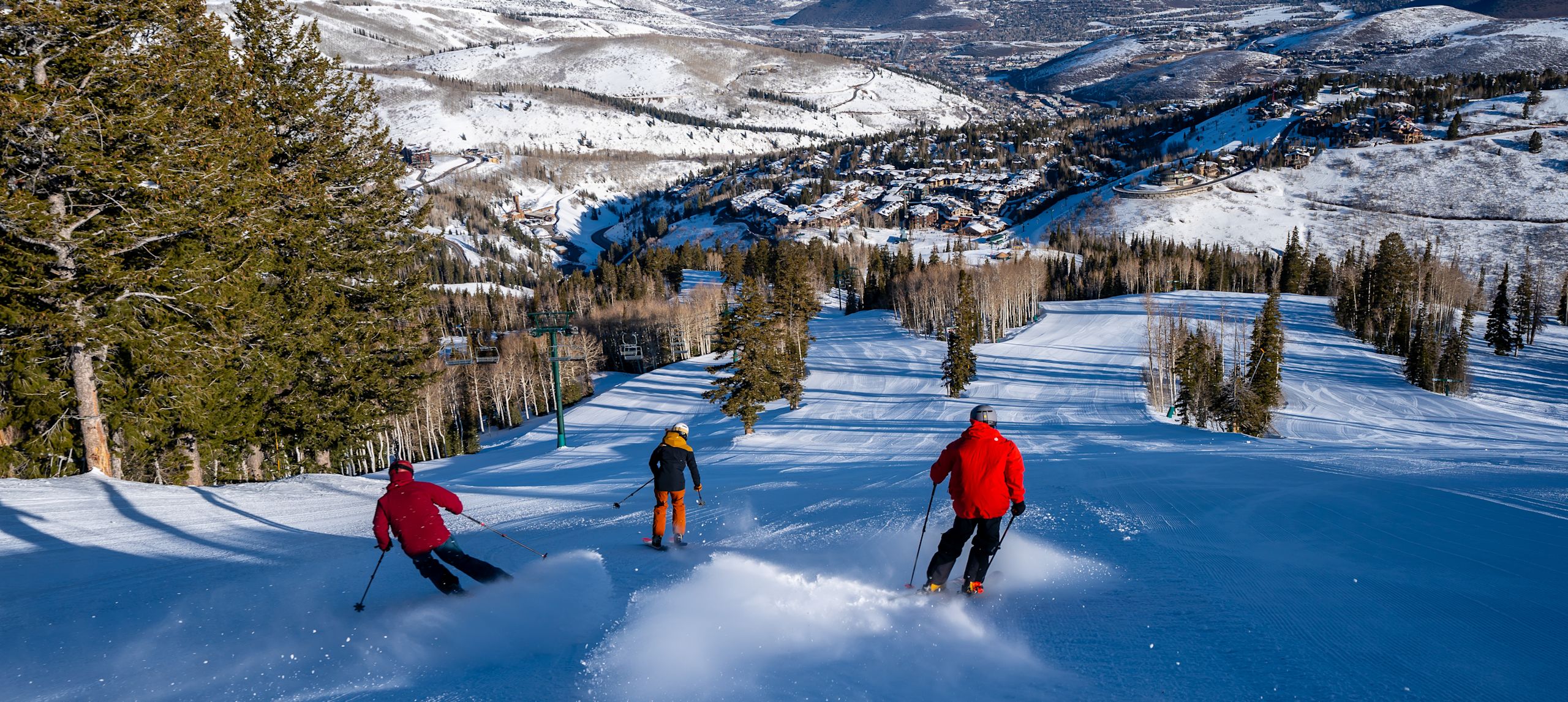 A Group of People Skiing Down a Mountain