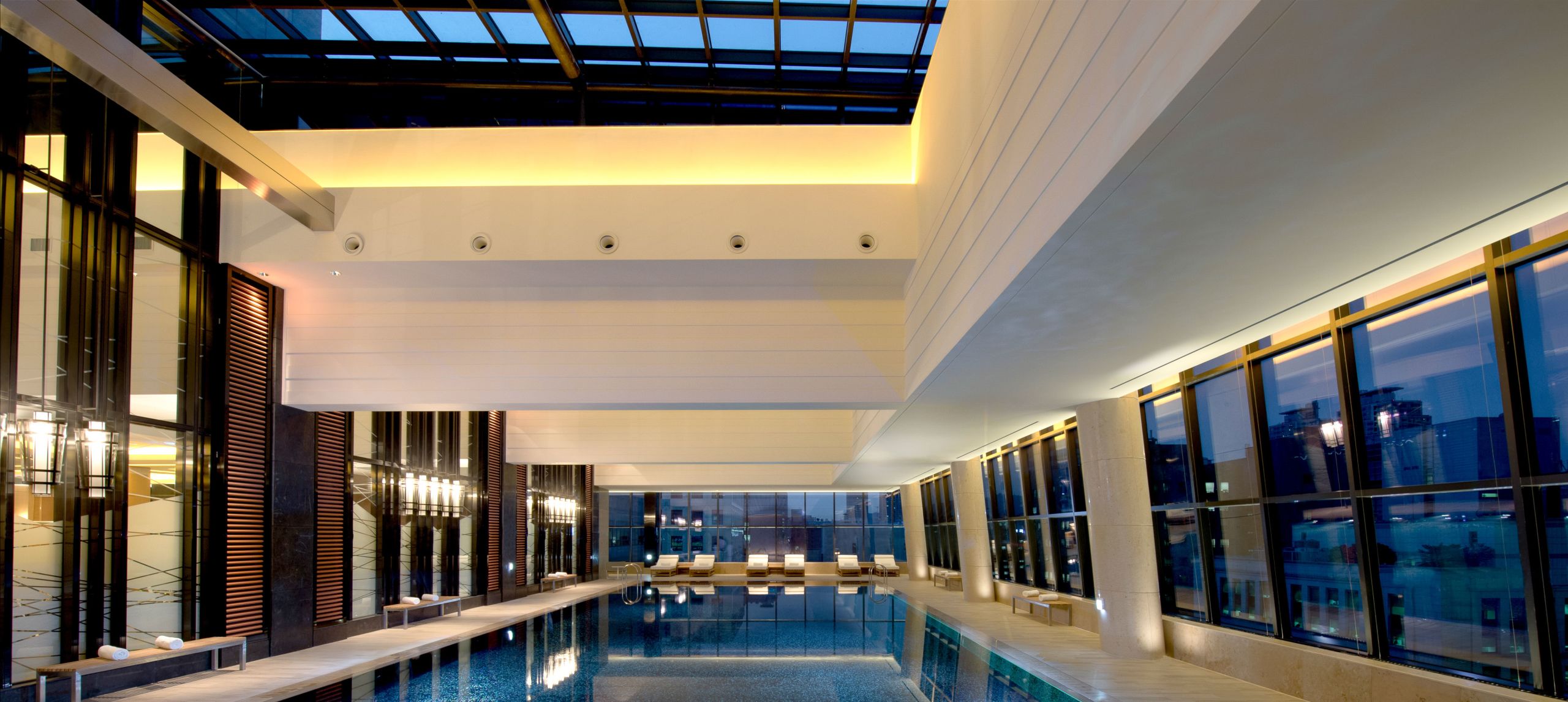 Pulse8 lap swimming pool, surrounded by floor to ceiling windows