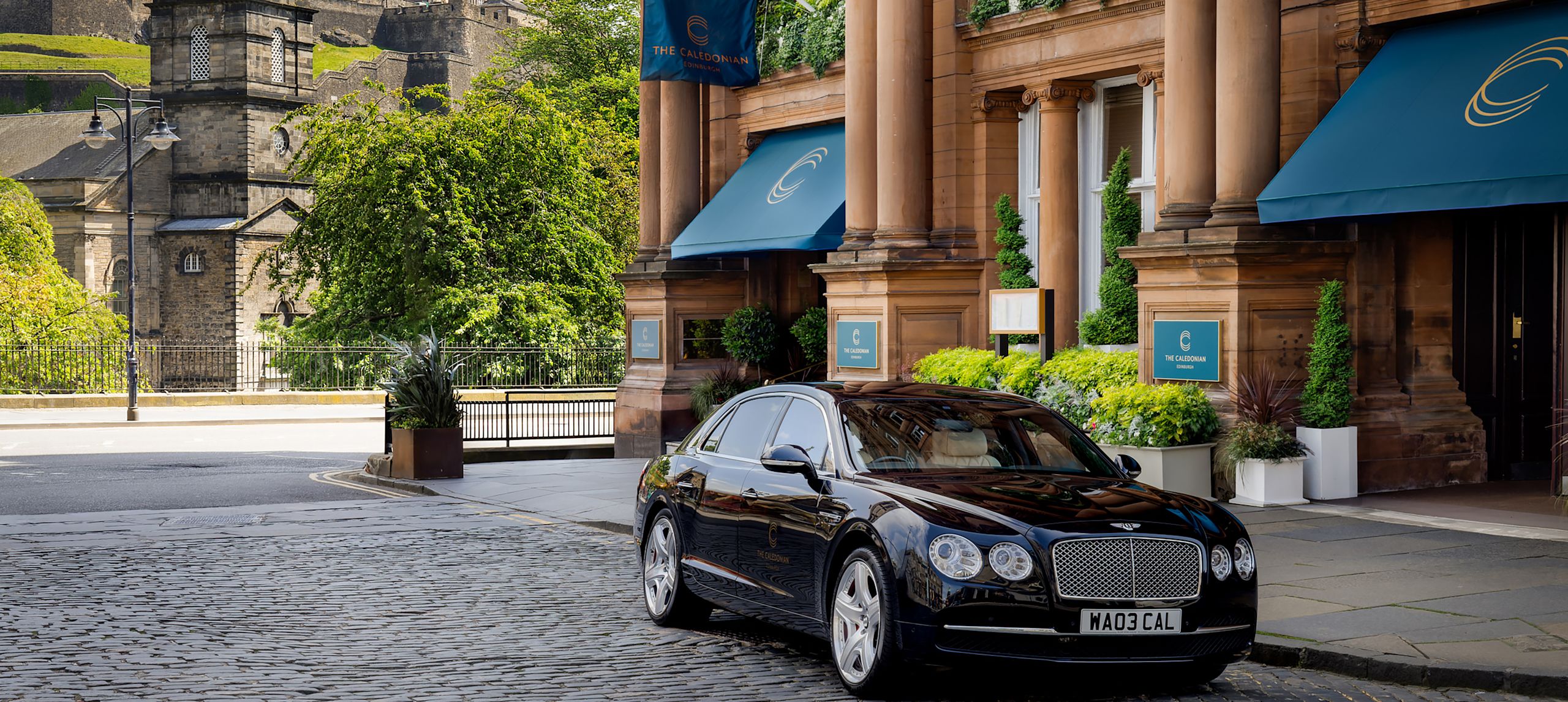 Bentley outside front door of hotel