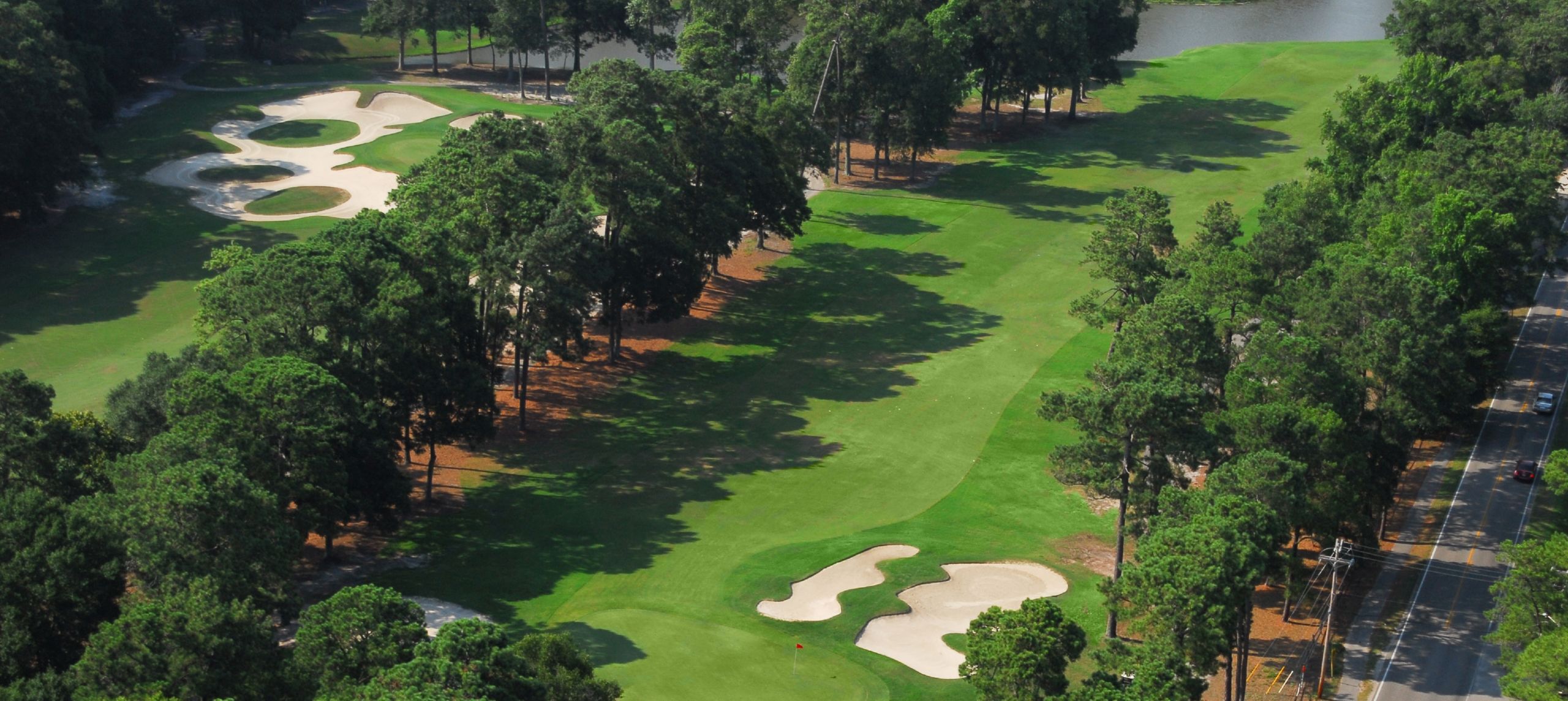 Aerial view of Arcadian Shores #1 and #3 greens and bunkers