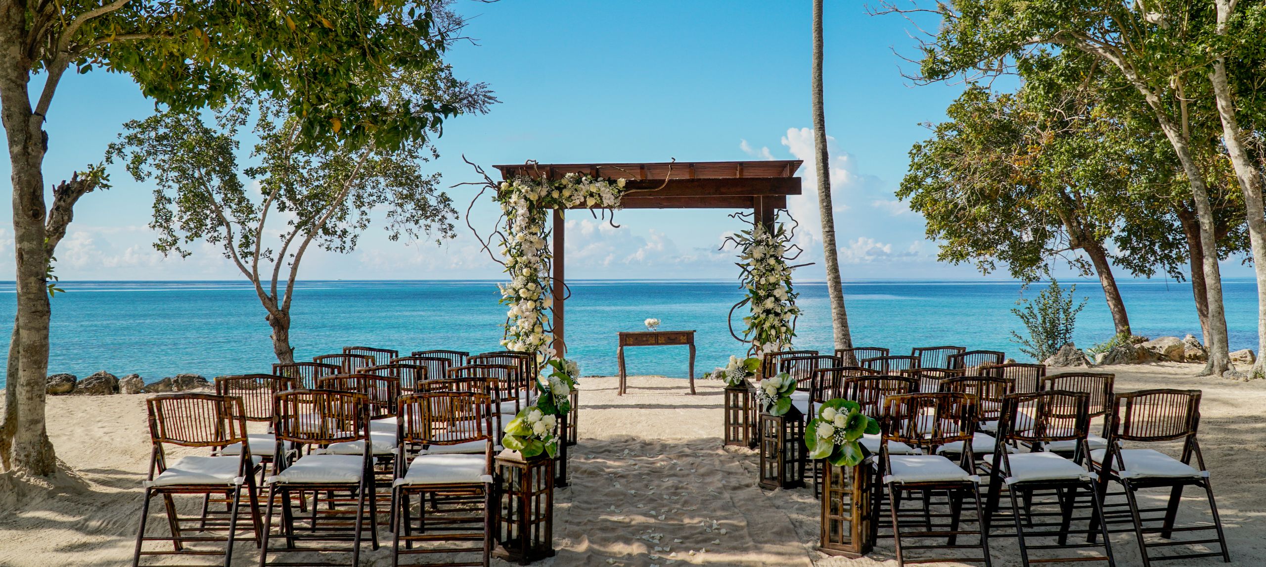Wedding setup on the beach with ocean as backdrop