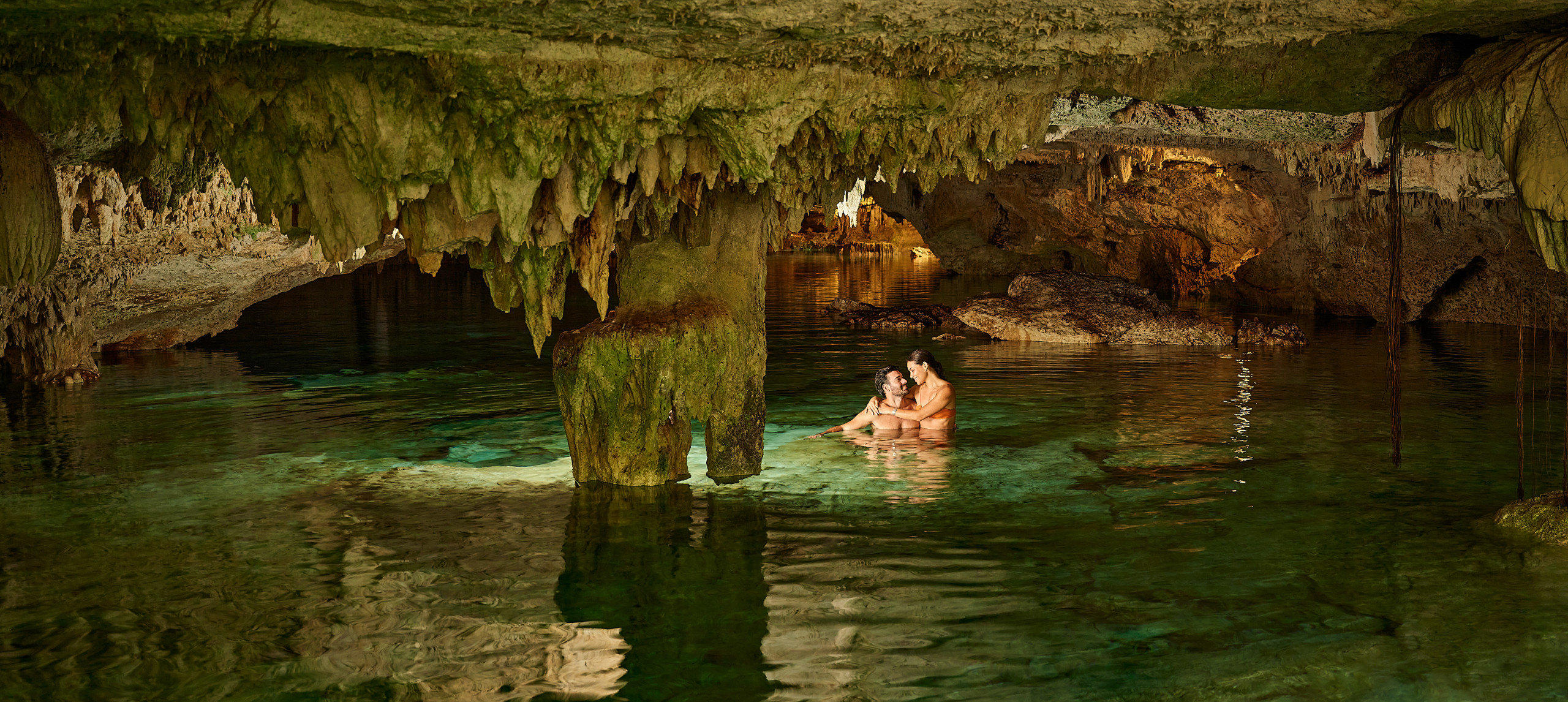 couple in cavern water