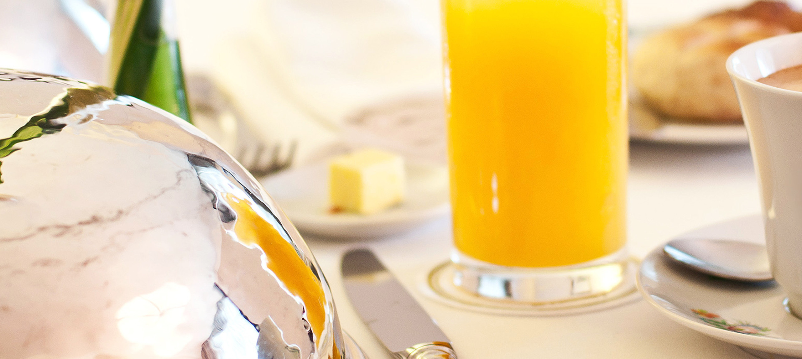 Close Up of Glass of Orange Juice on Dining Table