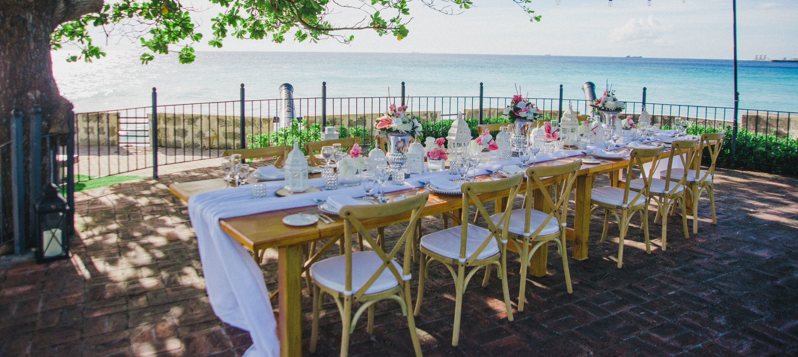 outdoor event table setting with view of water