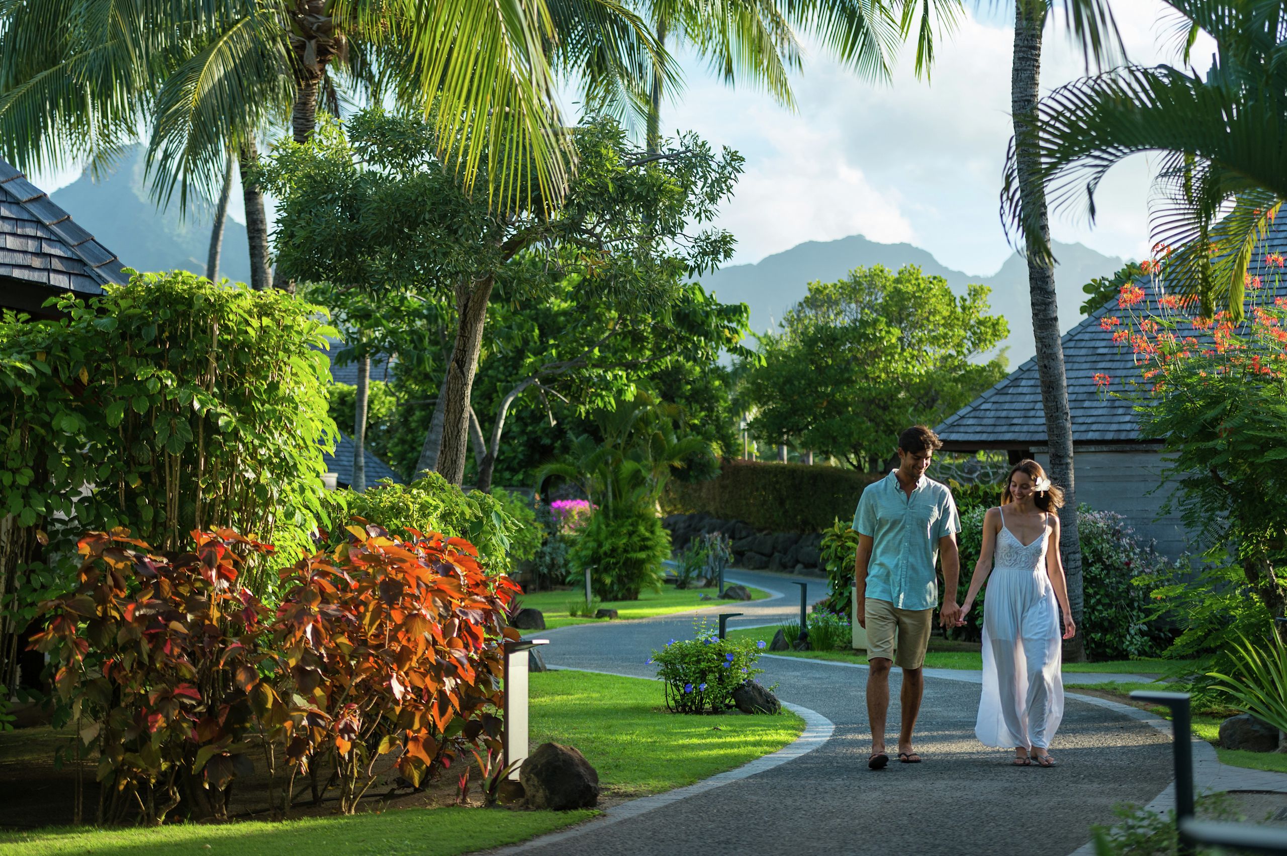 Couple Walking in Hotels Tropical Gardens