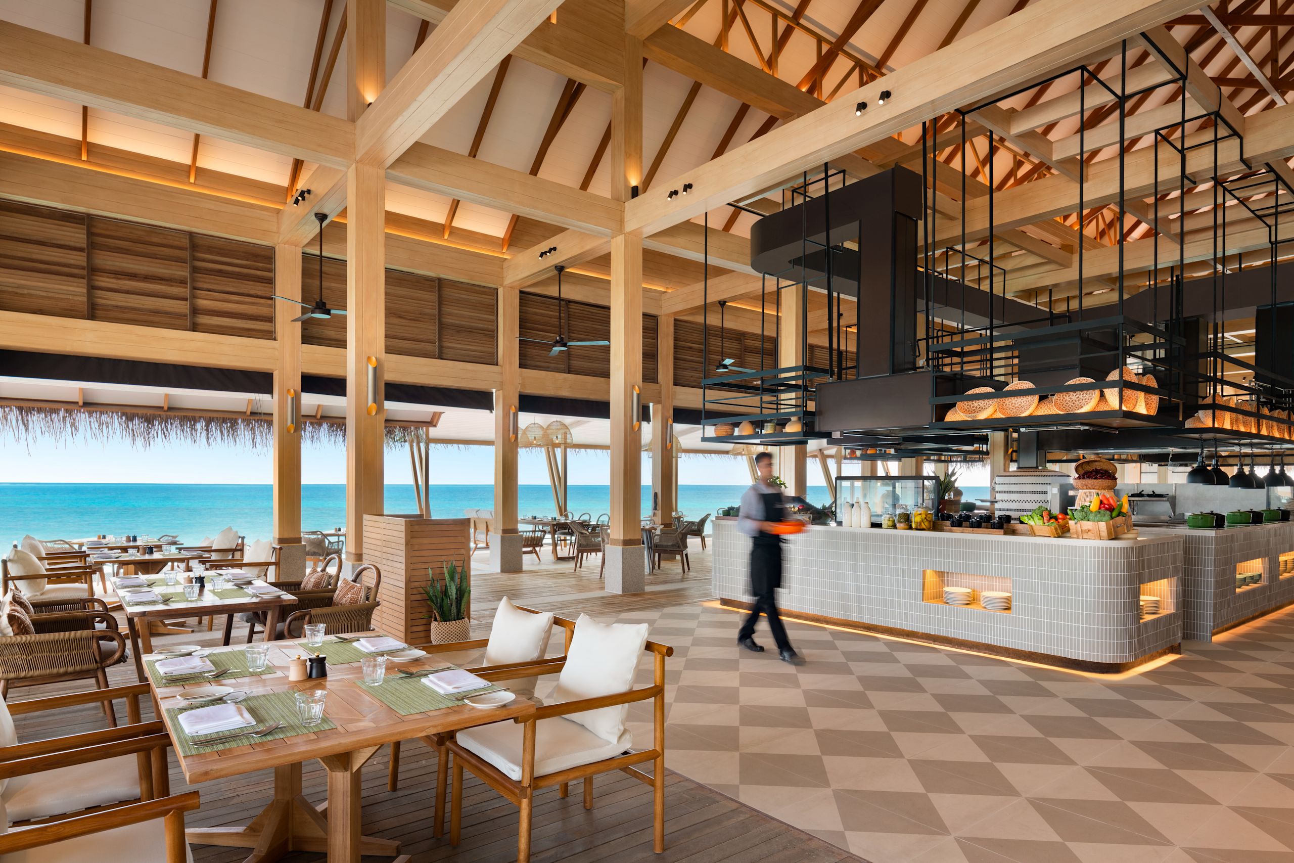 Habitat dining area with serving staff