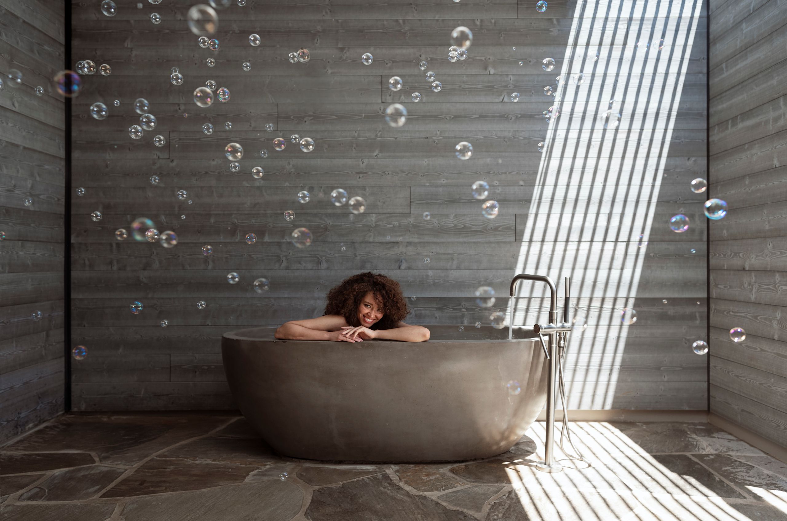 View of woman in spa bathtub