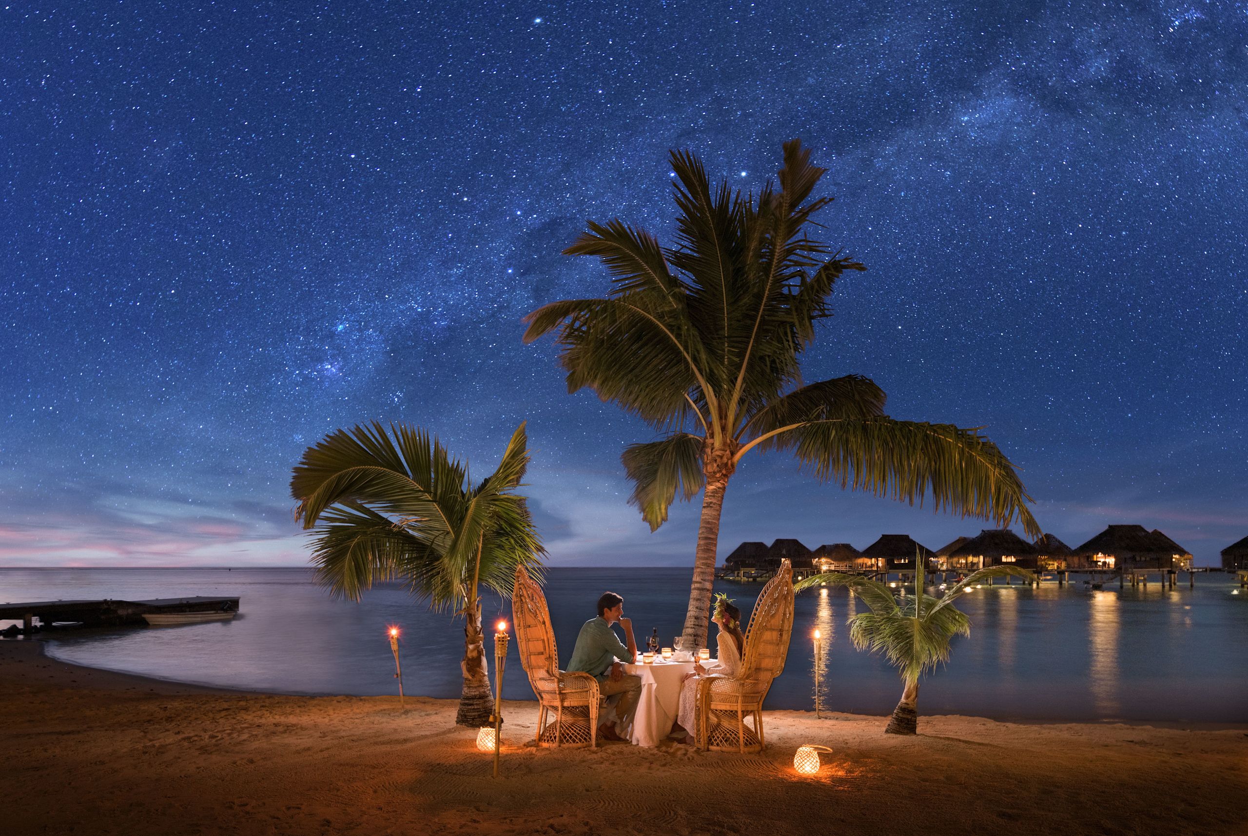 Couple Having a Romantic Dinner on Private Beach at