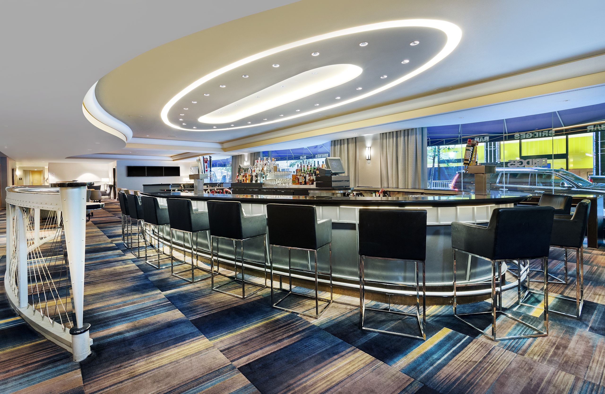 Bridges Bar in Oval Setting with Black Chairs