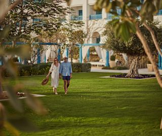 Two people walking outside