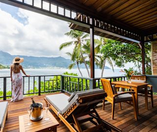 Woman Standing in a Terrace with Ocean View