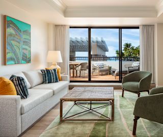 Suite Living Area and a Large Balcony in a Hotel Suite