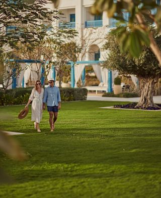 Two people walking outside