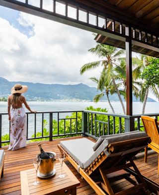 Woman Standing in a Terrace with Ocean View