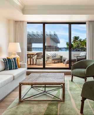 Suite Living Area and a Large Balcony in a Hotel Suite