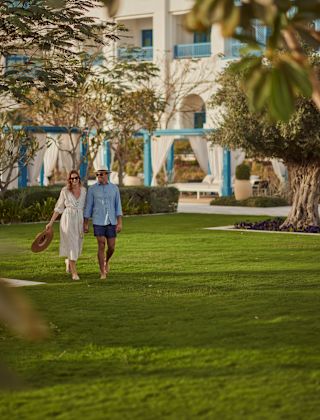 Two people walking outside