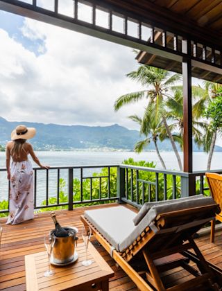 Woman Standing in a Terrace with Ocean View
